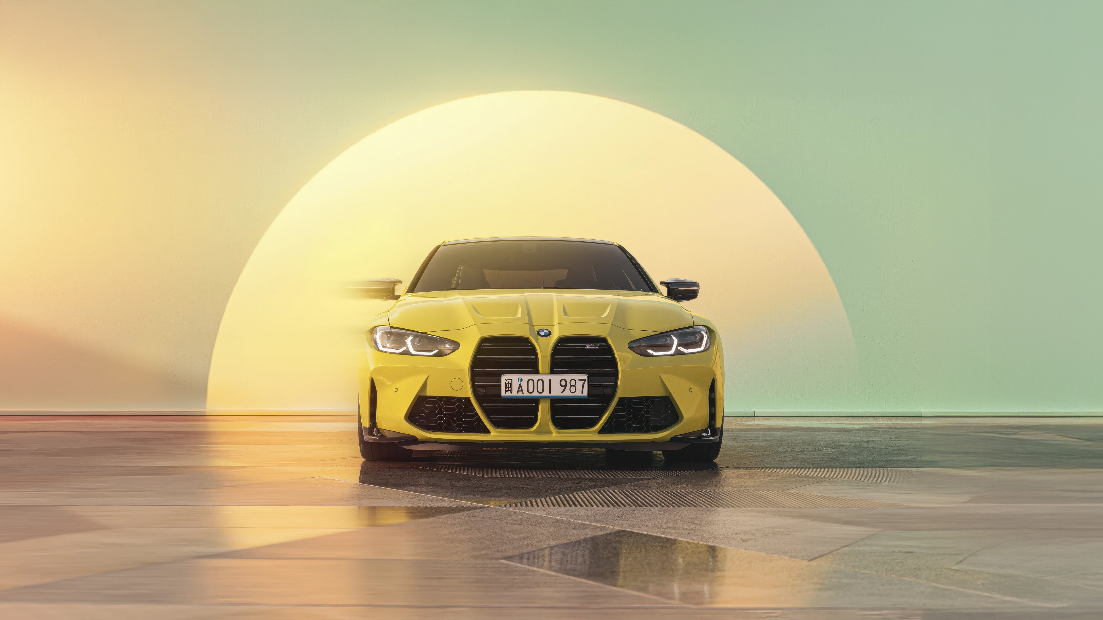 Yellow BMW M4 G82 parked indoors HD Wallpaper
