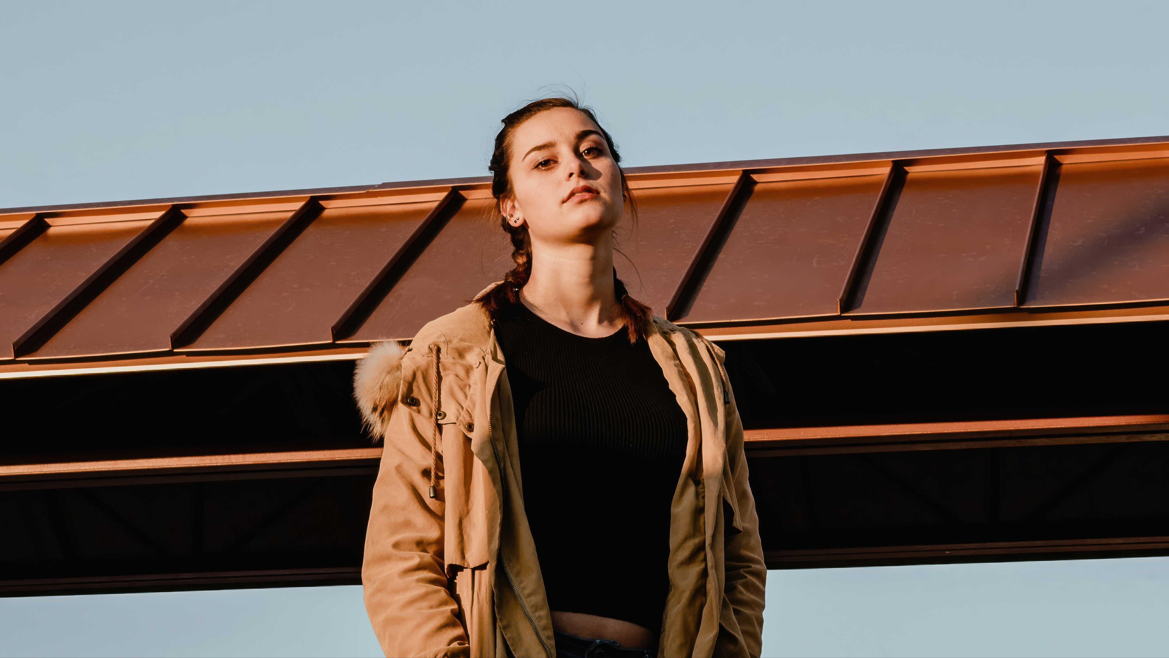 Girl on a parking deck during golden hour HD Wallpaper