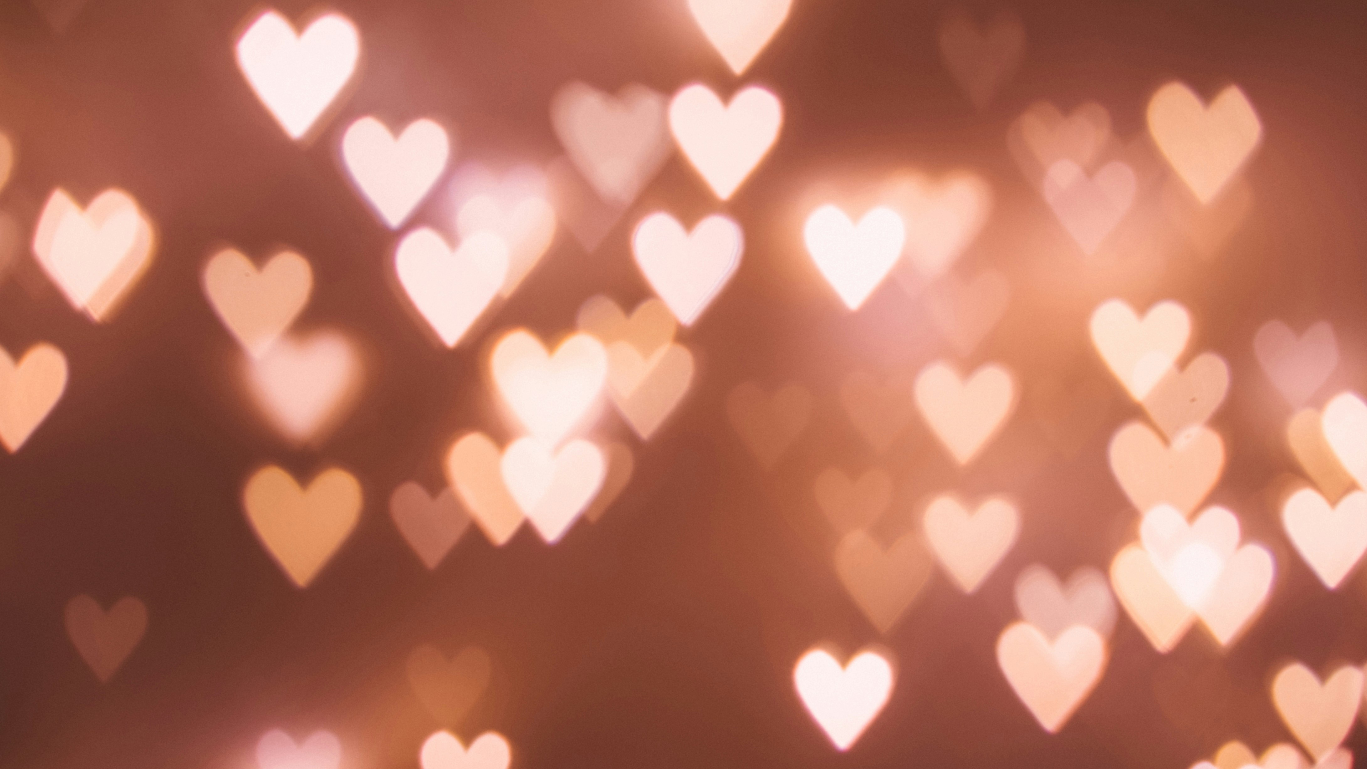 Heart-shaped bokeh lights in warm tones HD Wallpaper