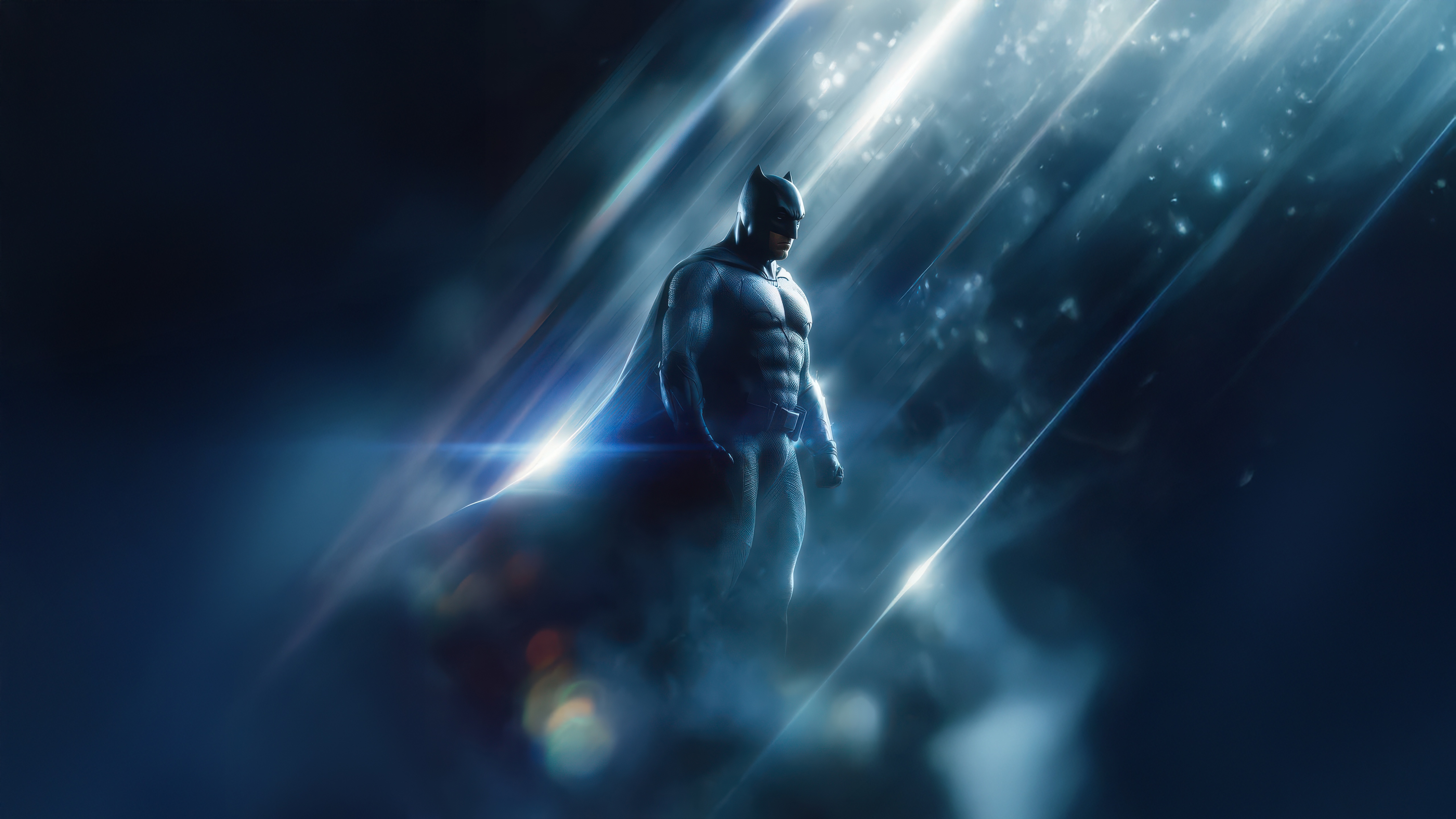 Batman standing in dramatic lighting HD Wallpaper