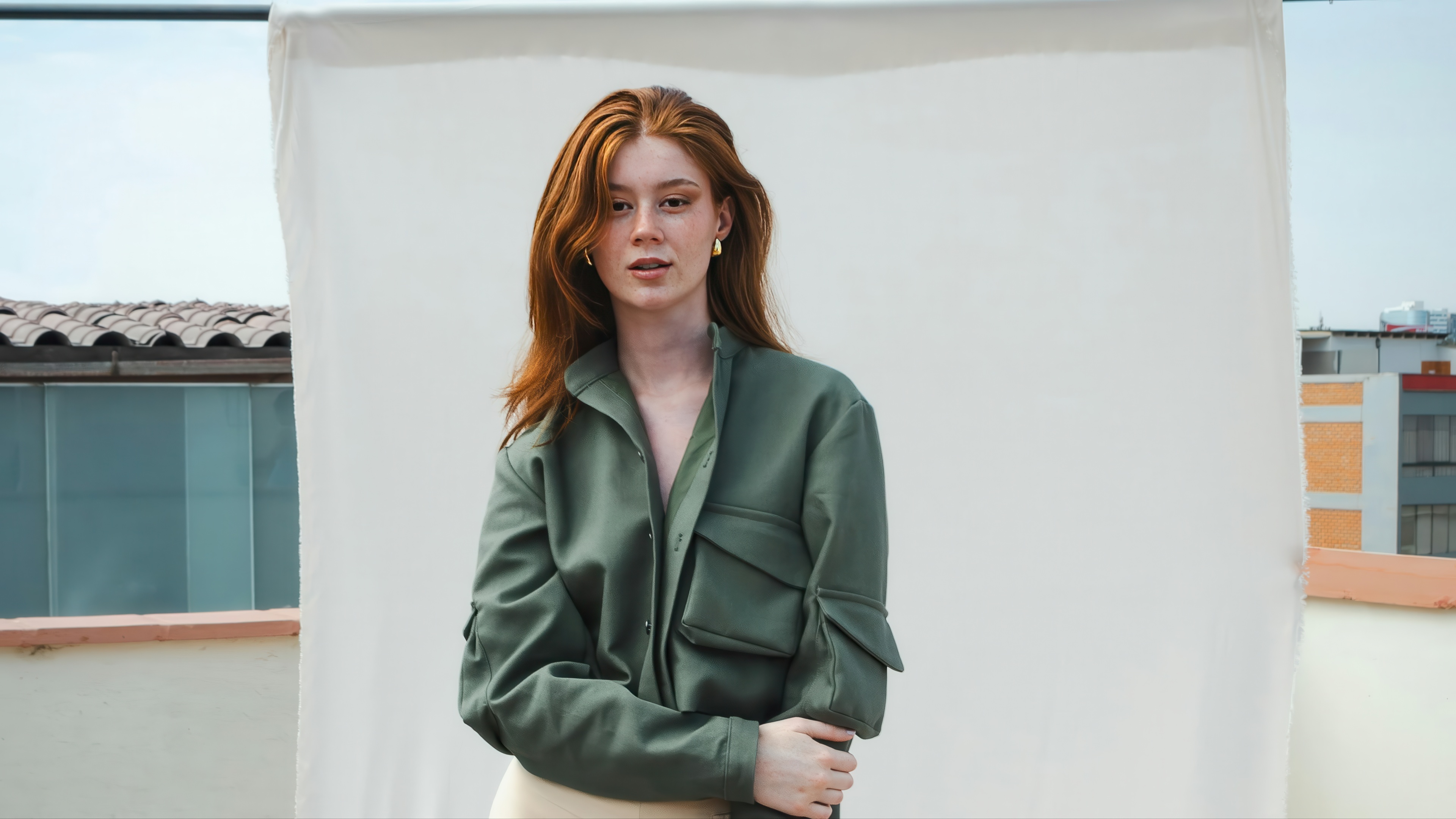 Girl in green jacket on rooftop photoshoot HD Wallpaper