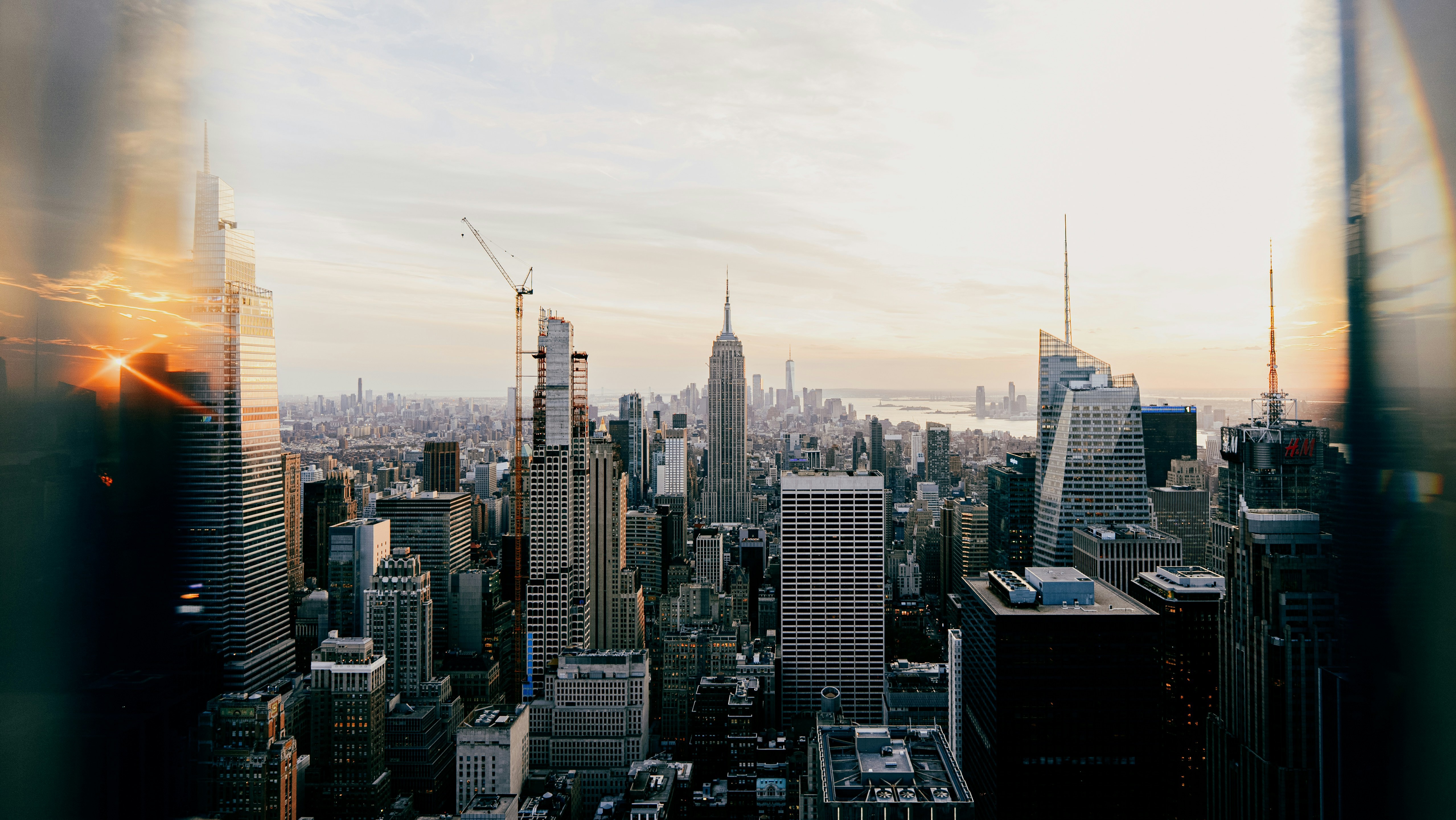 Sunset over New York City skyline with Empire State Building HD Wallpaper
