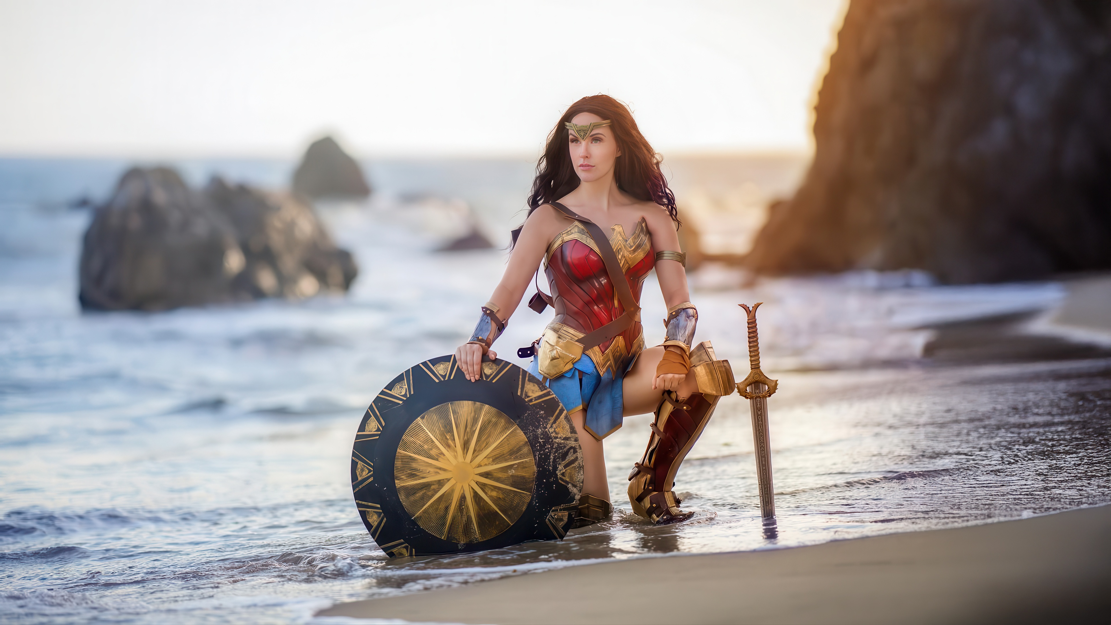 Wonder Woman on a beach with shield and sword HD Wallpaper