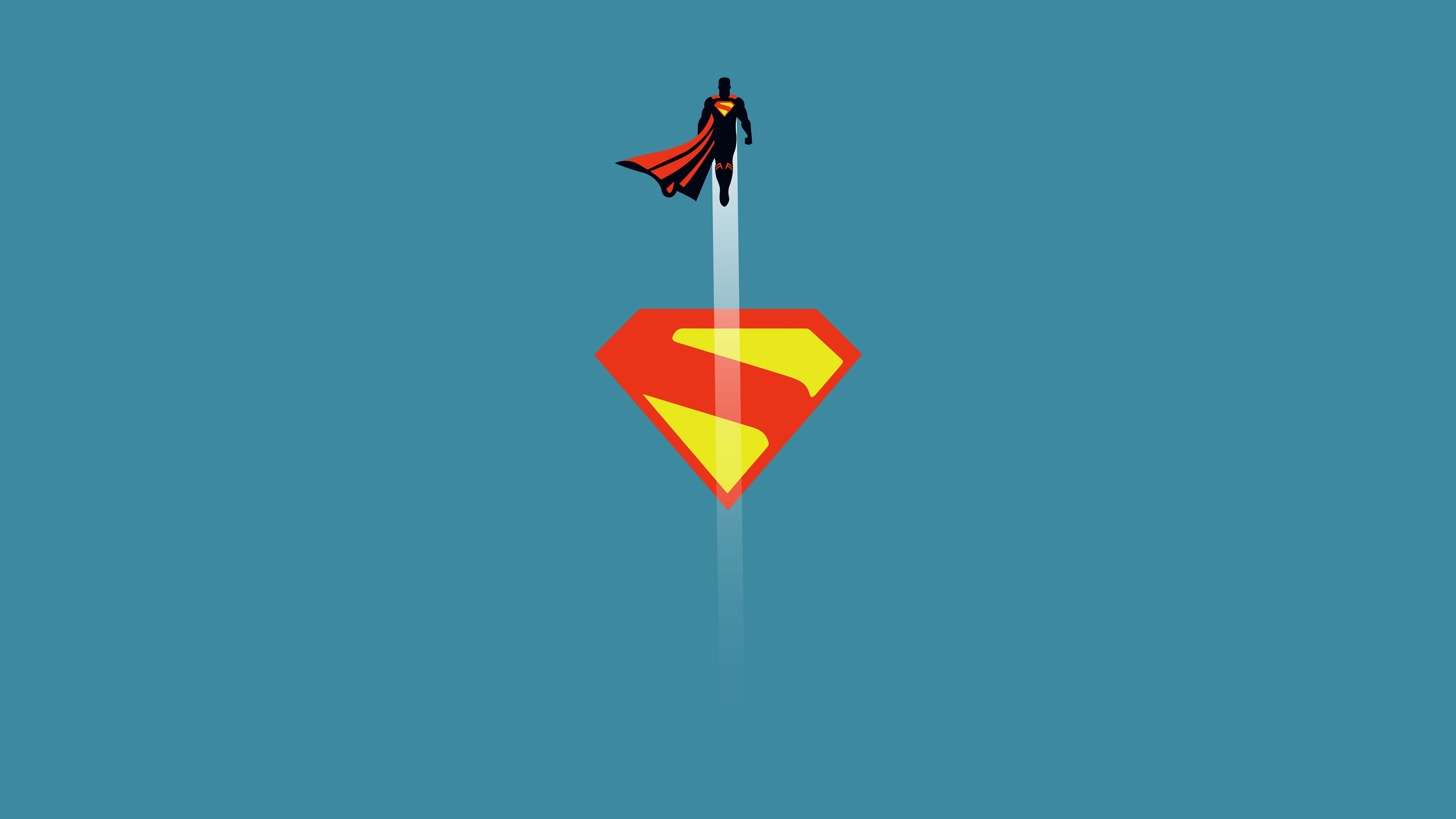 Superman flying above the S-shield logo HD Wallpaper