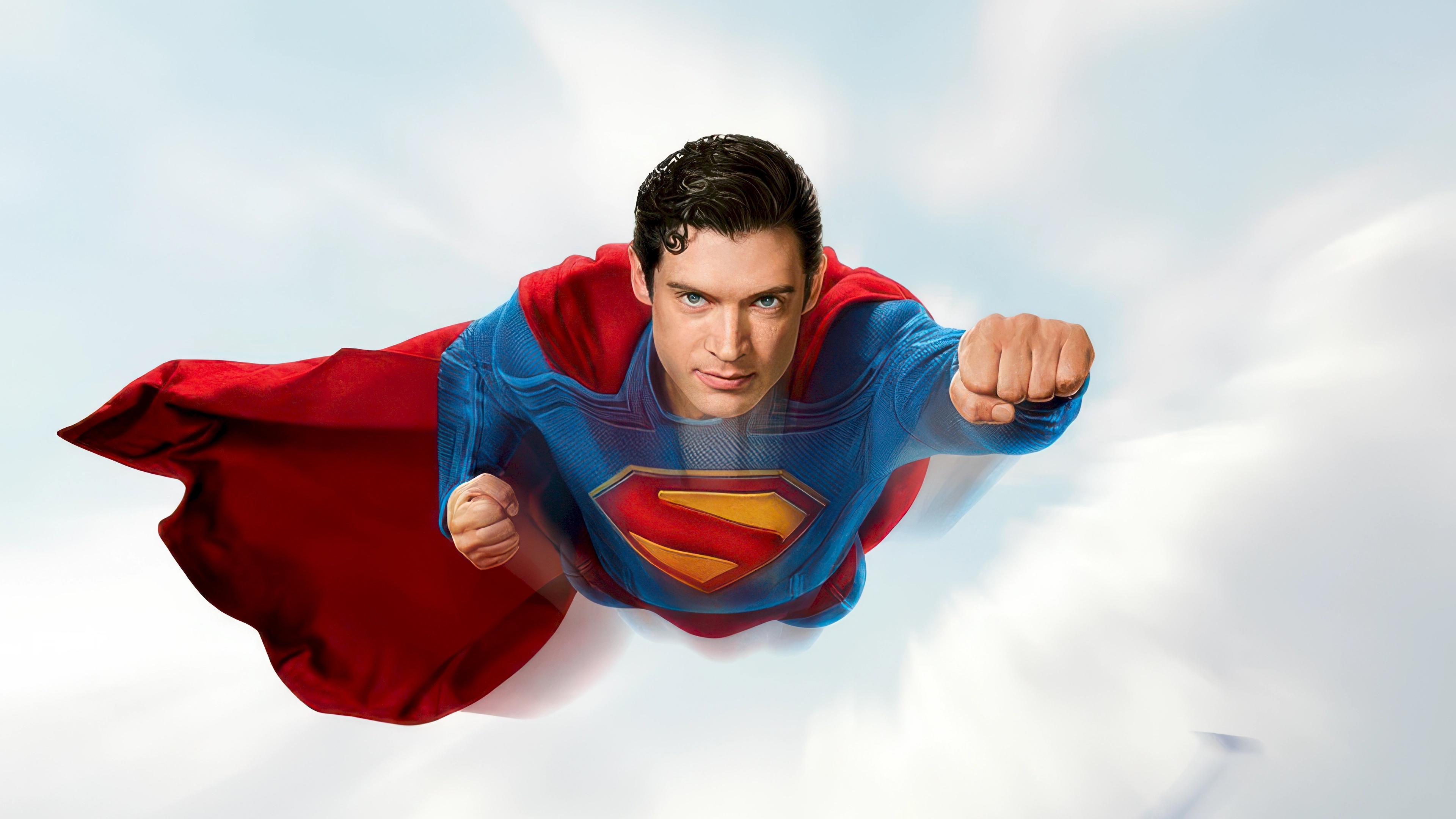Superman flying through clouds HD Wallpaper