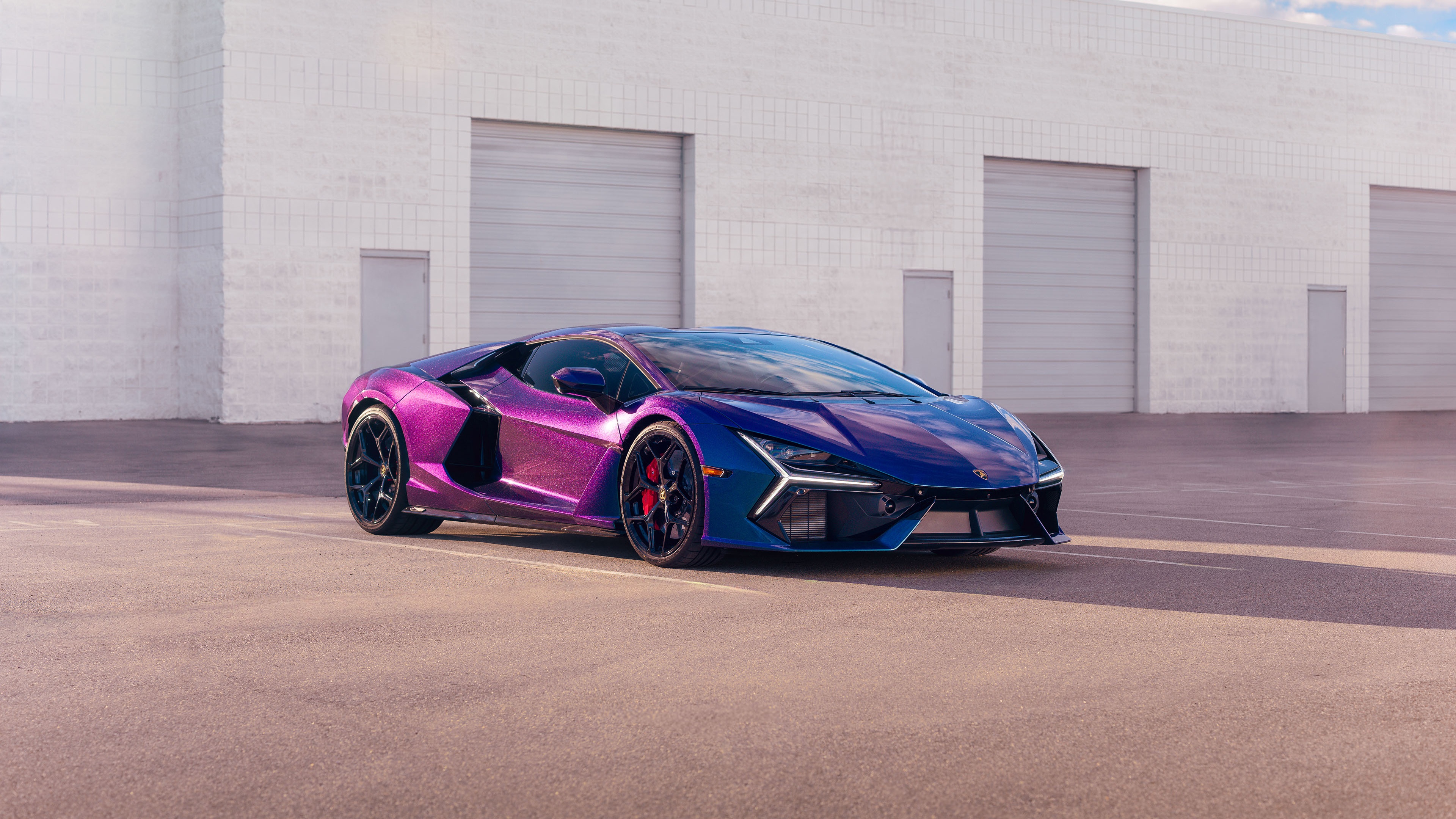 Lamborghini Revuelto in a parking lot HD Wallpaper