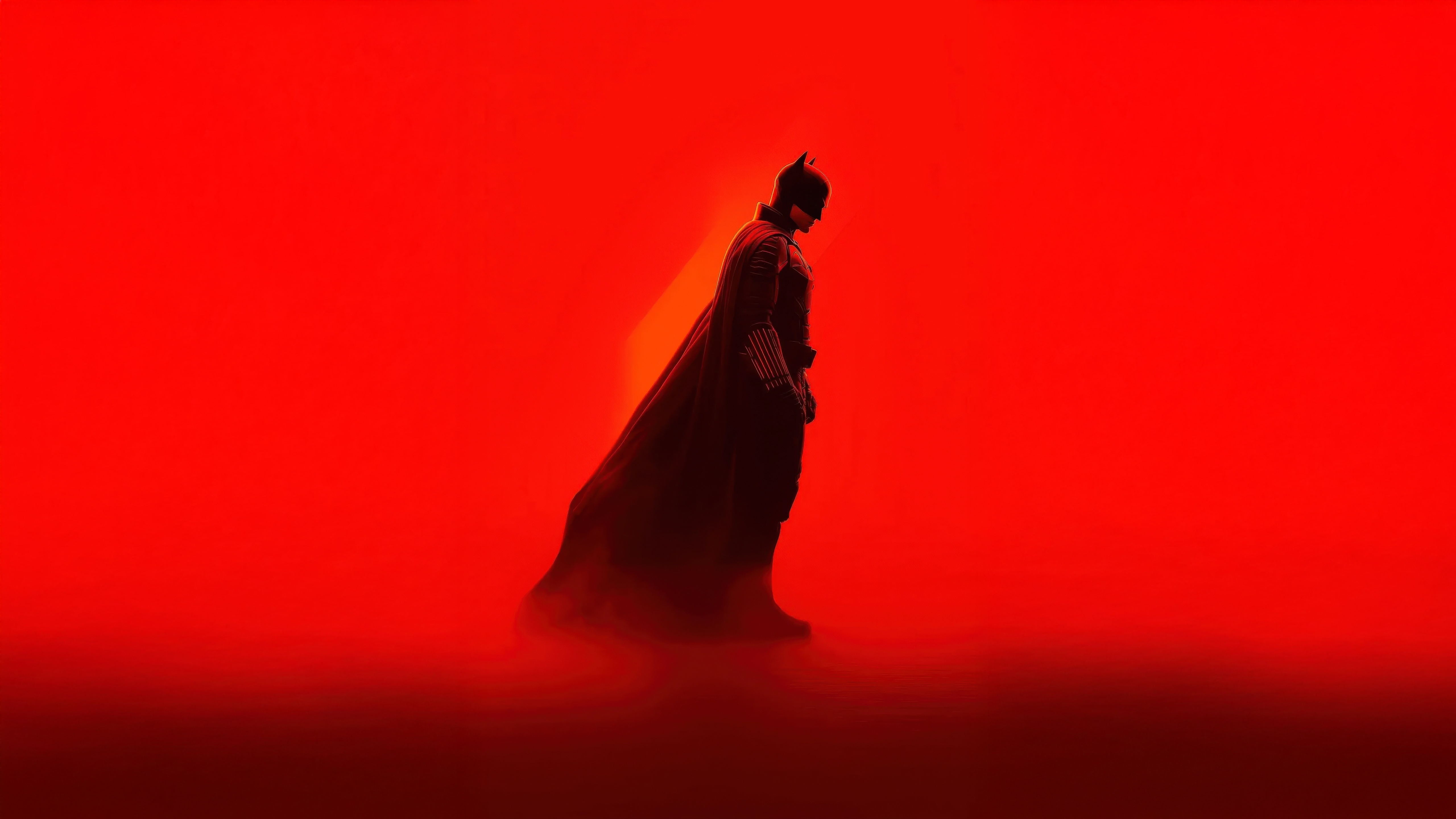 Batman in silhouette against a red background HD Wallpaper