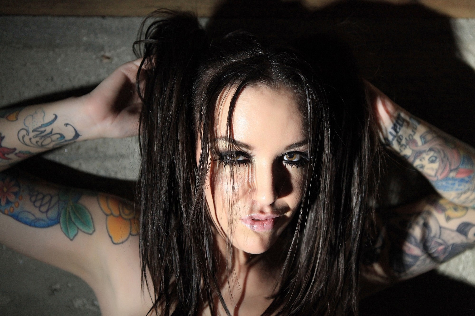 Woman with dark hair and tattoos HD Wallpaper