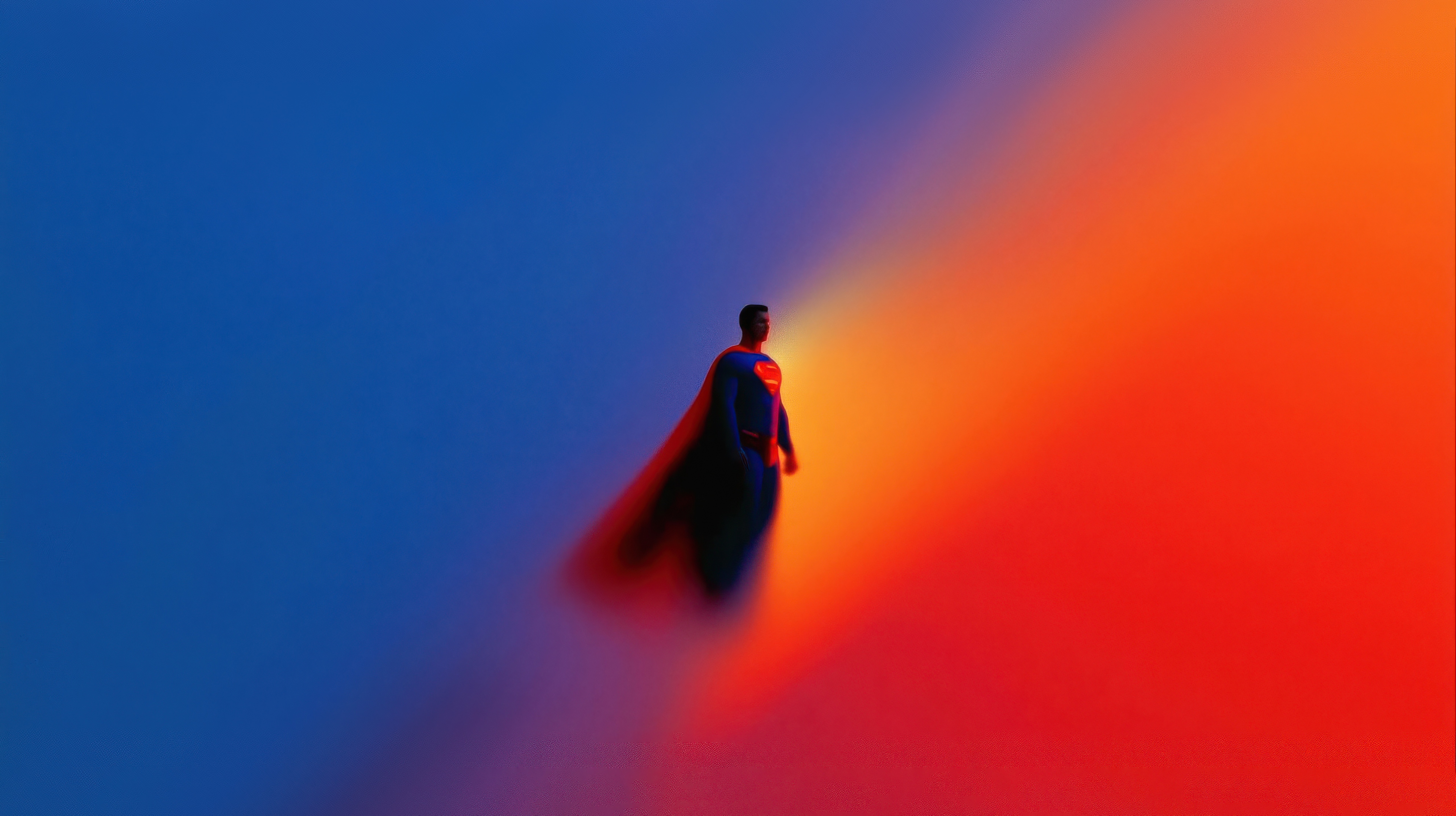 Superman in motion against a blue and orange gradient HD Wallpaper
