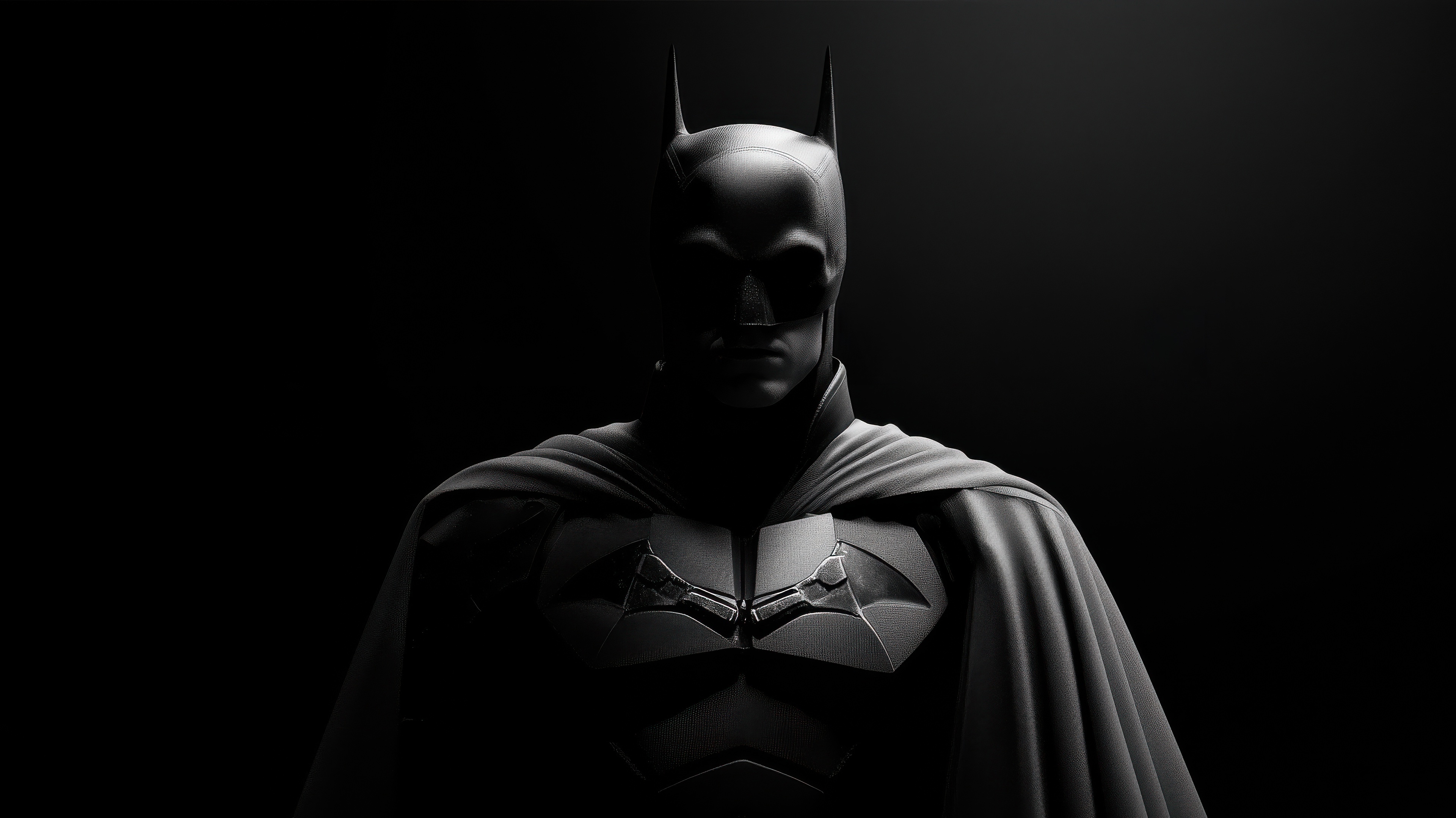 The Batman in a dark, dramatic pose HD Wallpaper
