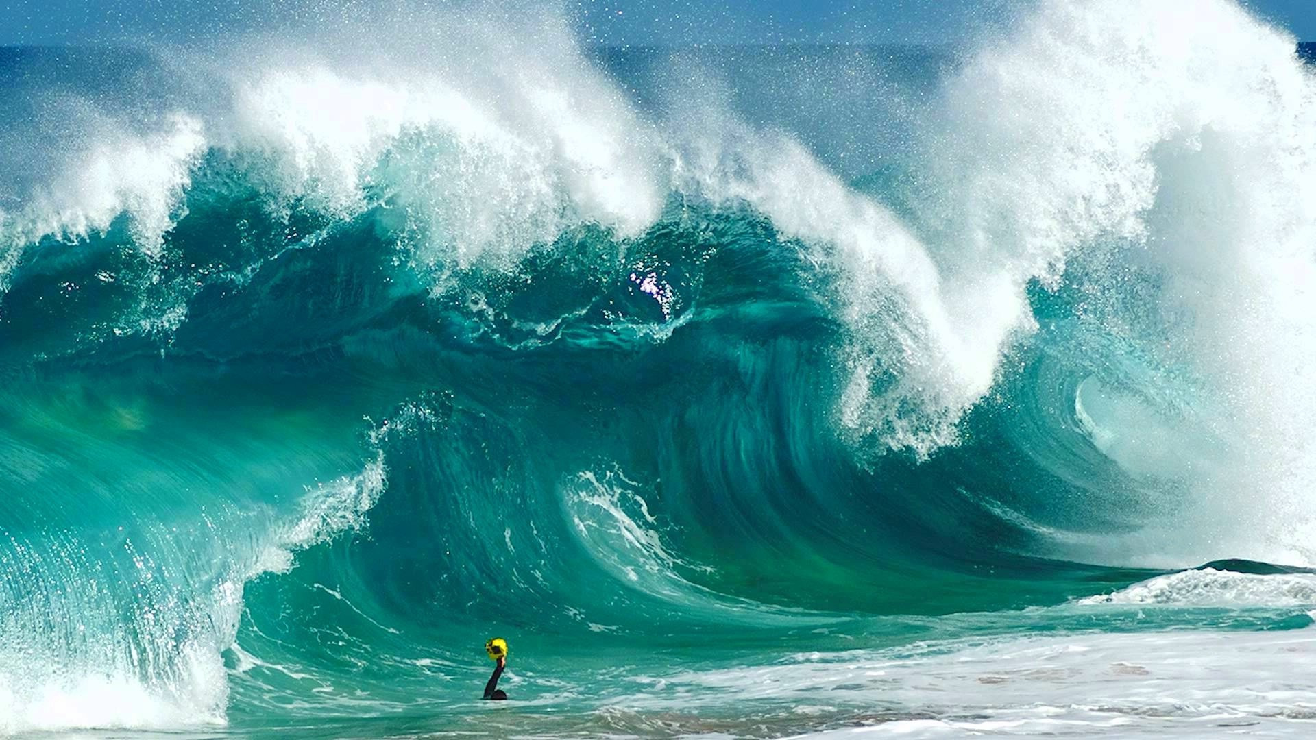 Surfer in a massive ocean wave HD Wallpaper