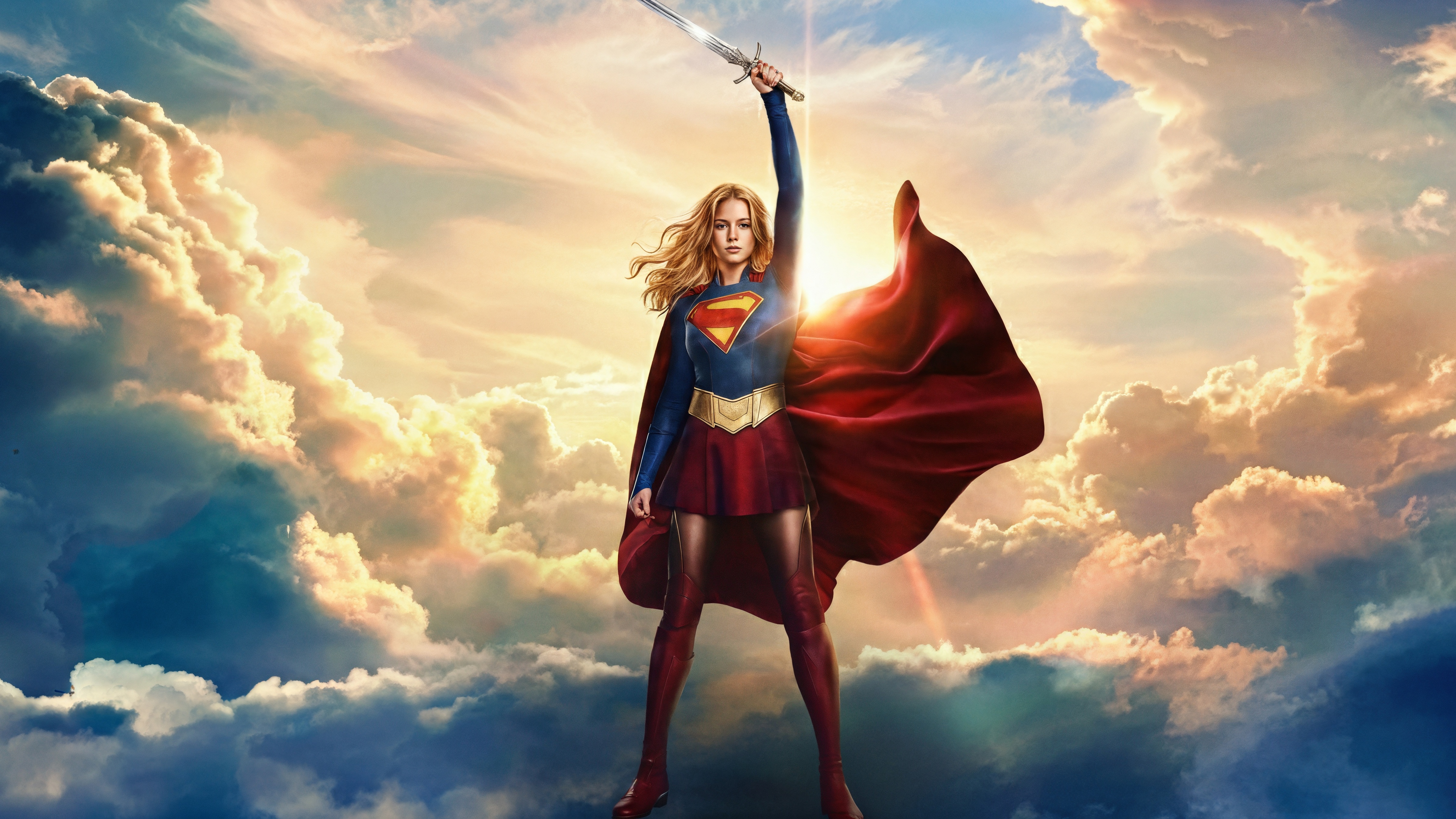 Supergirl holding a sword in the clouds HD Wallpaper