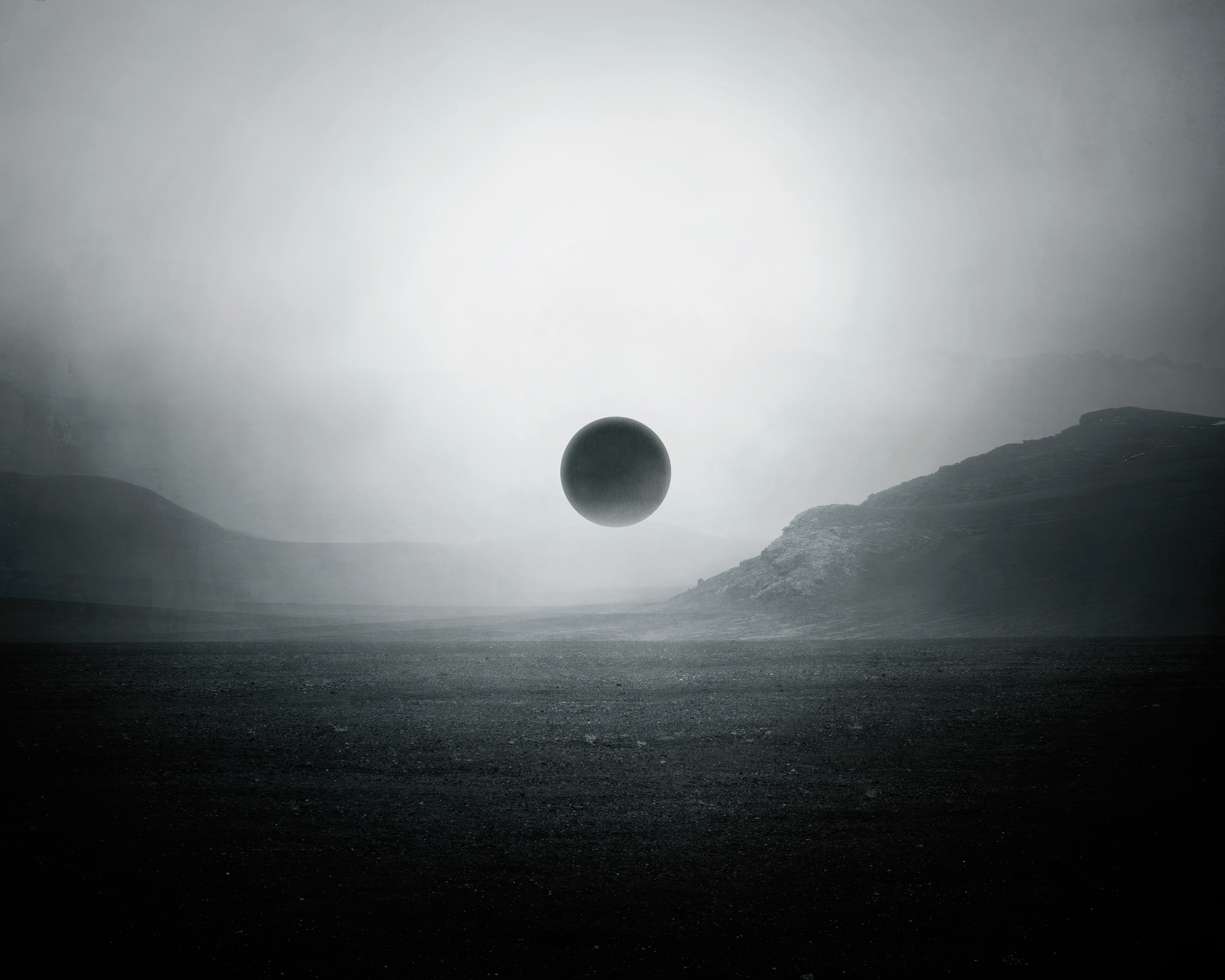 A dark sphere floats above a desolate landscape HD Wallpaper