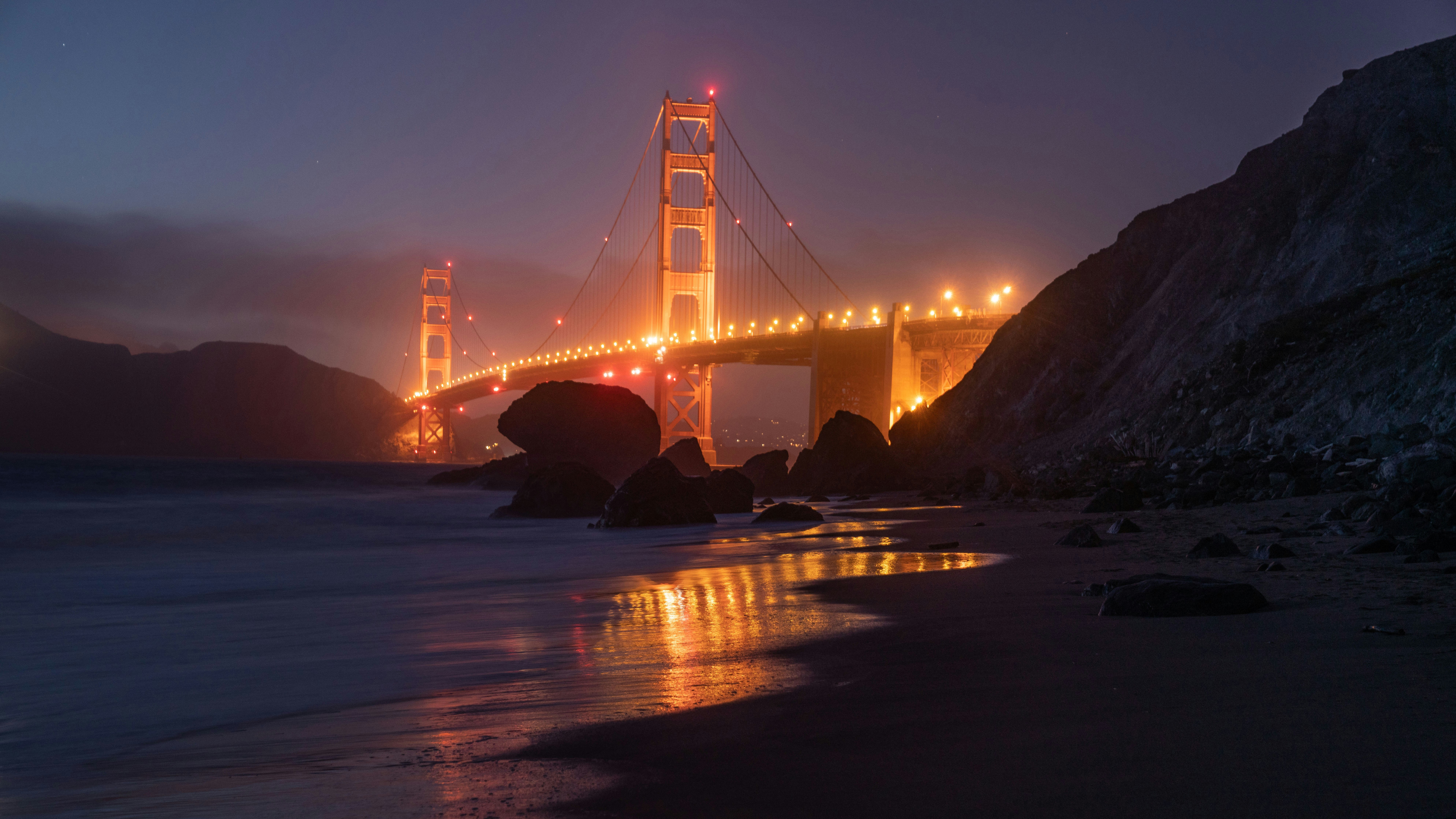 Golden Gate Bridge at dusk with ocean waves HD Wallpaper