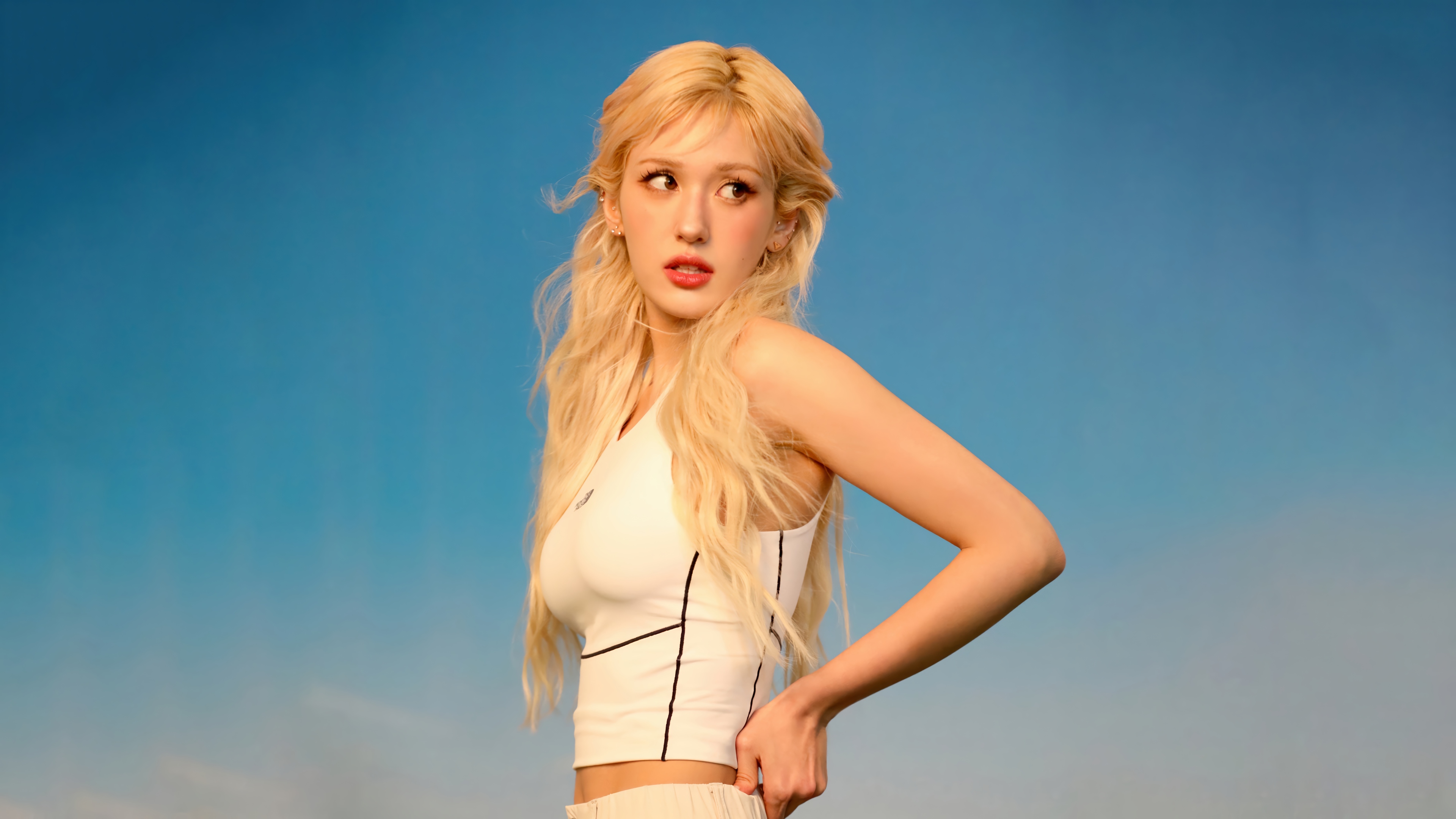 Jeon Somi in white top against blue sky 4K HD Wallpaper