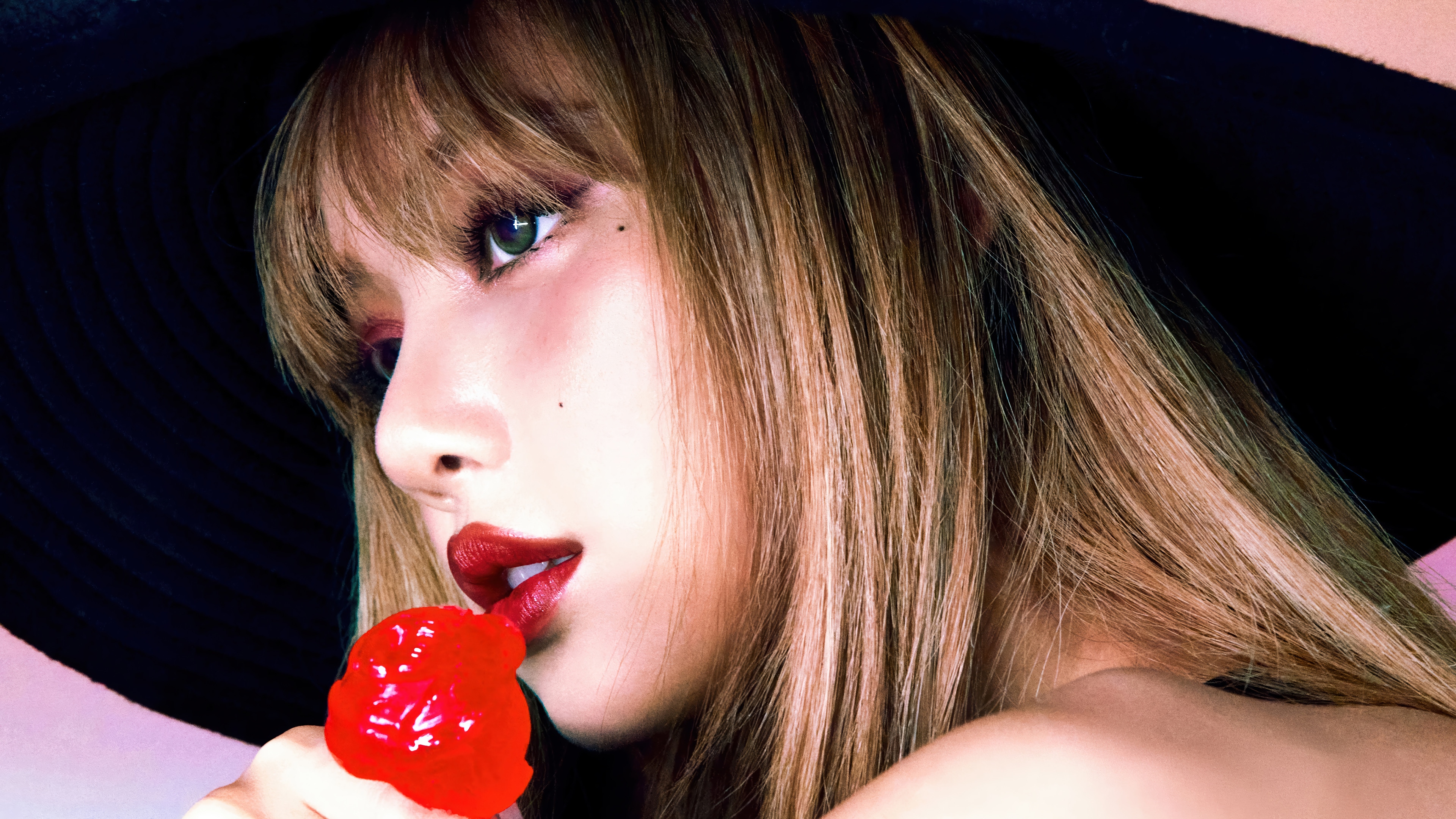 Lisa from BLACKPINK with a lollipop HD Wallpaper