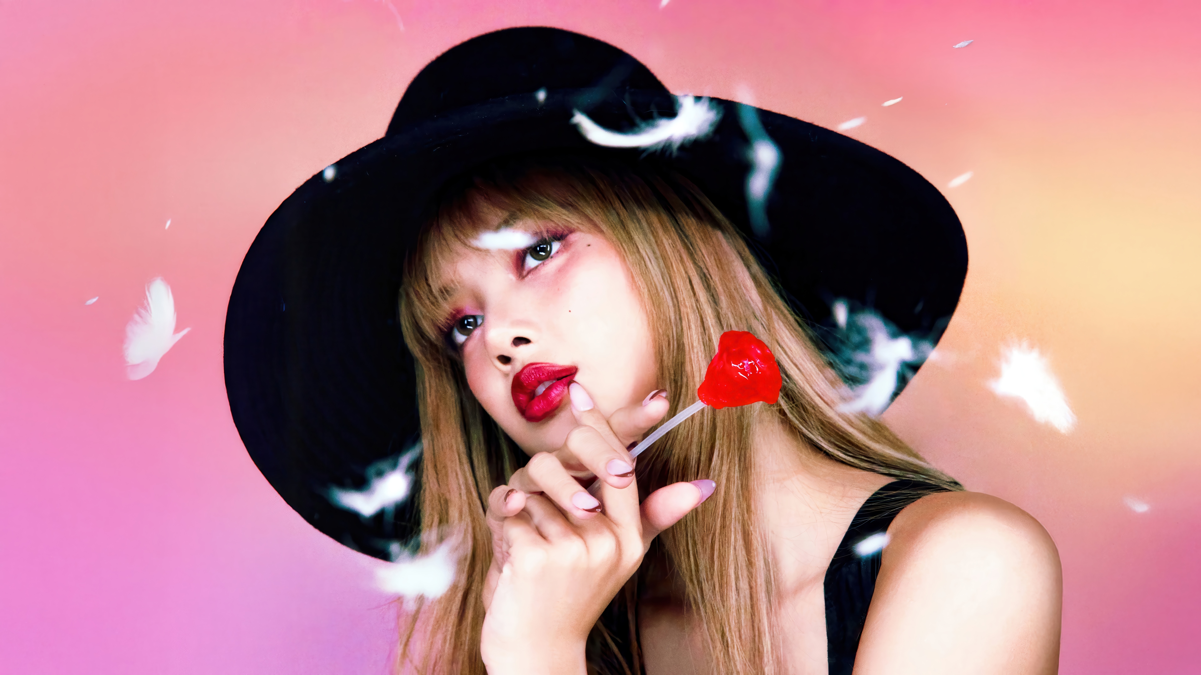 Lisa from BLACKPINK with a heart lollipop HD Wallpaper