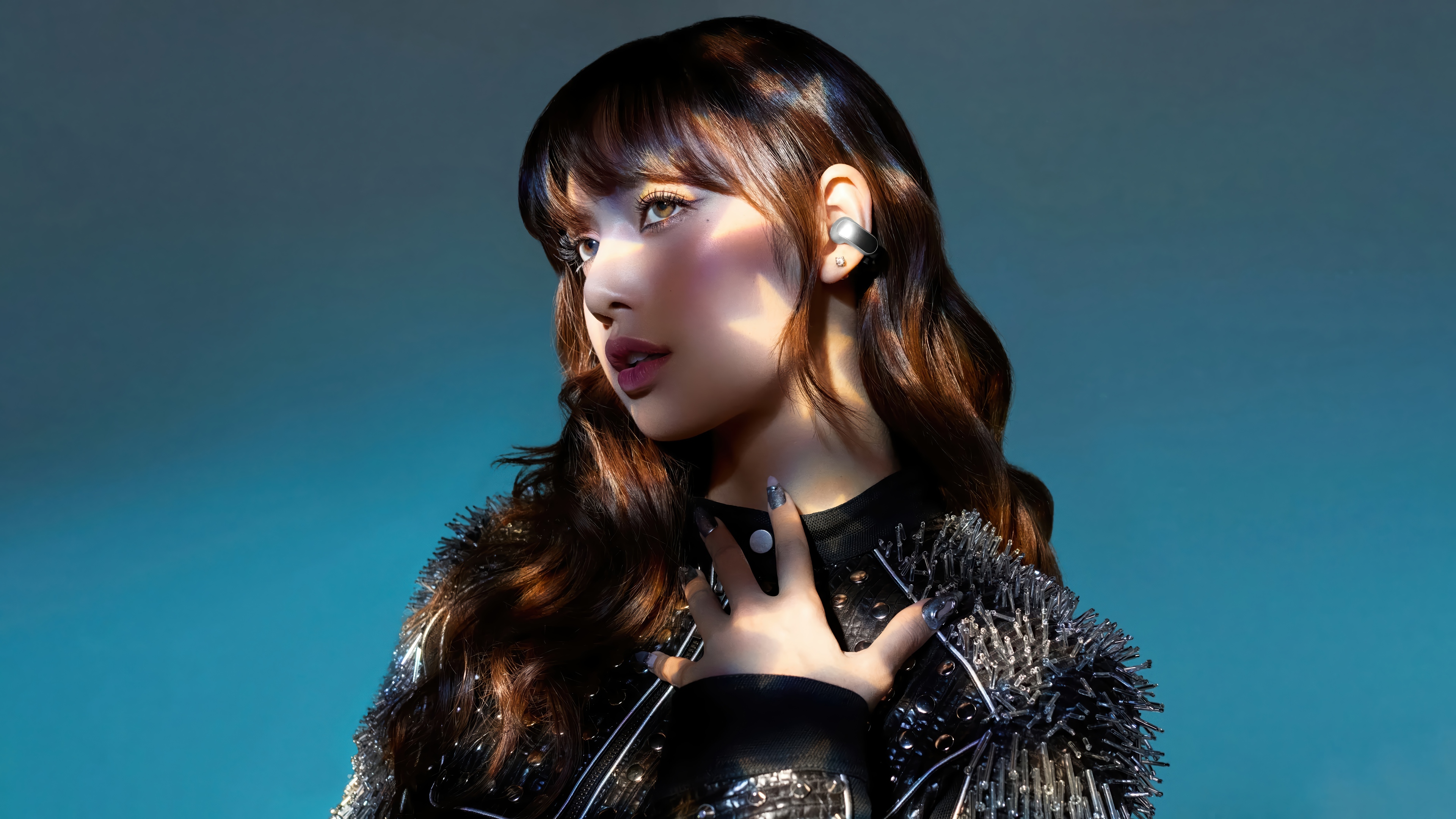 Lisa from BLACKPINK posing with a blue background HD Wallpaper