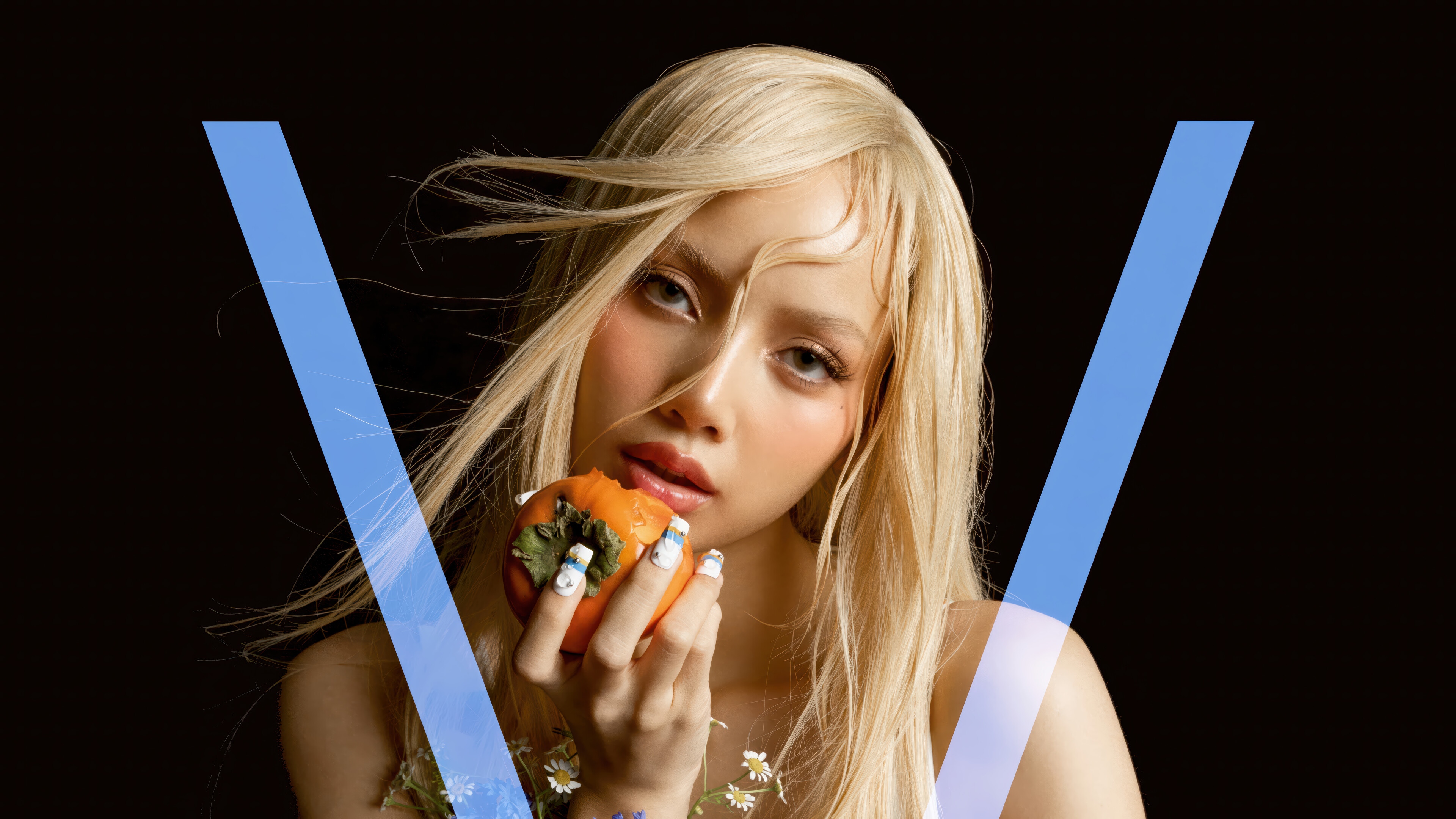 Lisa from BLACKPINK holds a persimmon HD Wallpaper