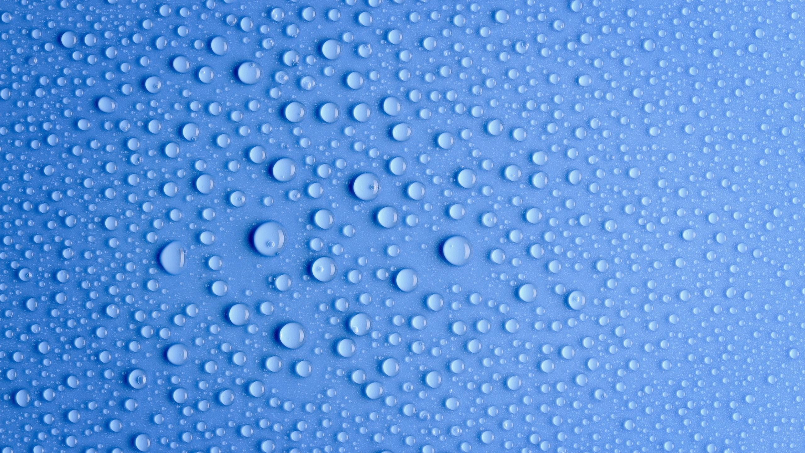 Water drops on a blue surface HD Wallpaper