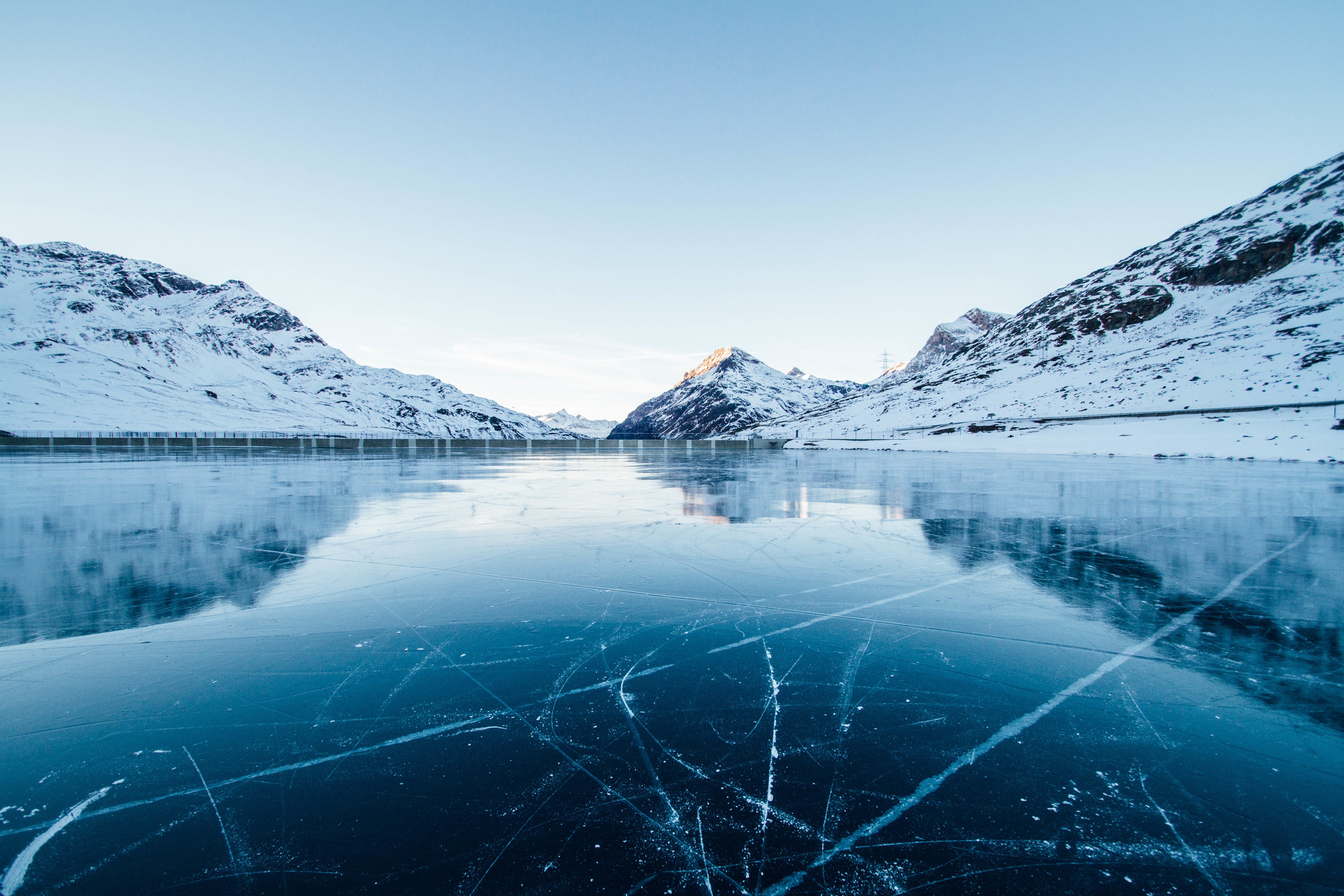Frozen lake and snow-covered mountains HD Wallpaper