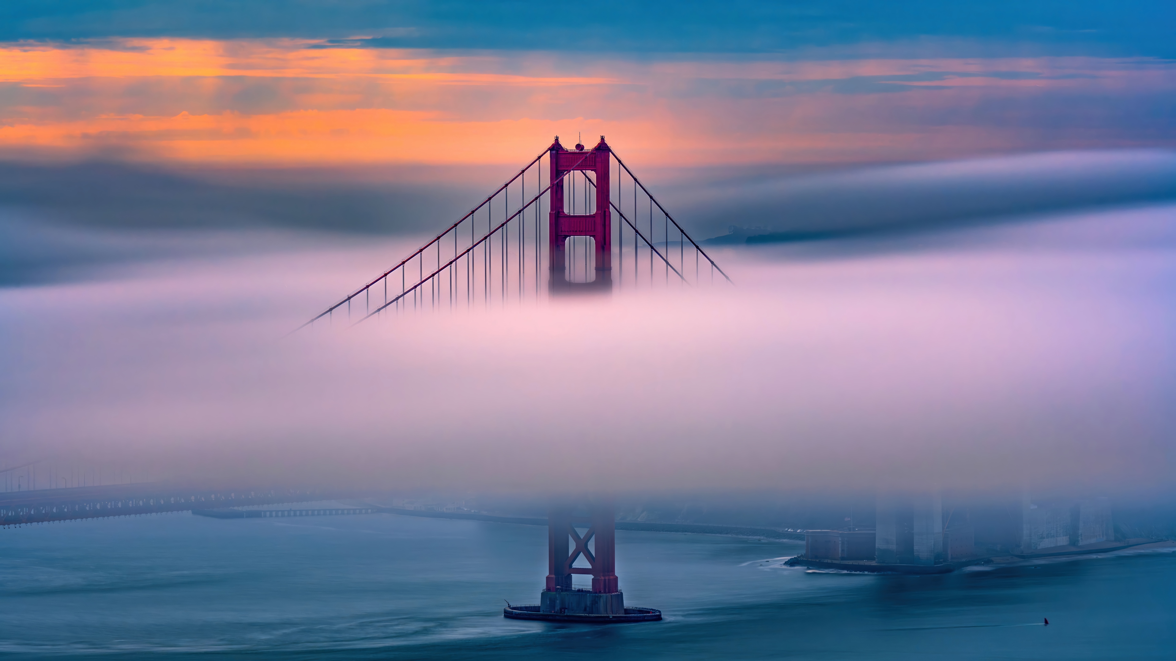 Golden Gate Bridge shrouded in fog at sunrise HD Wallpaper
