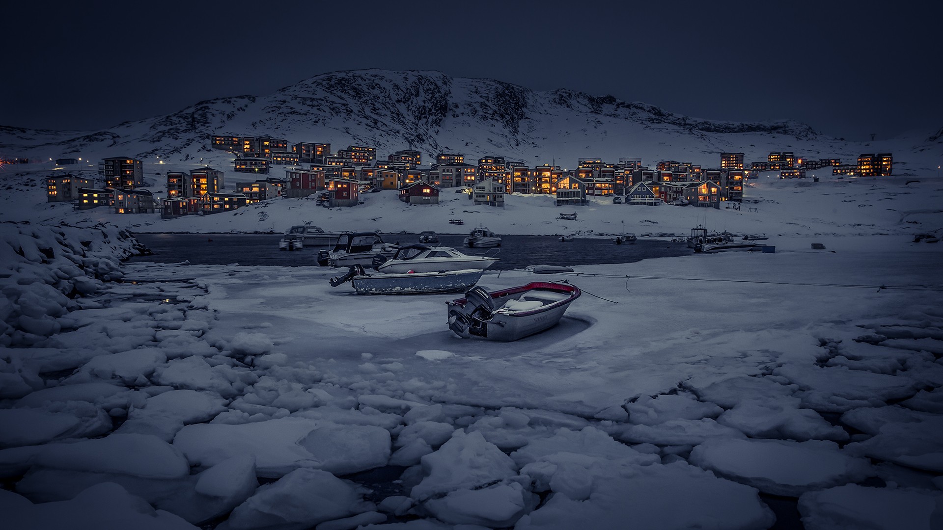 Winter village by the frozen sea in Greenland at night HD Wallpaper
