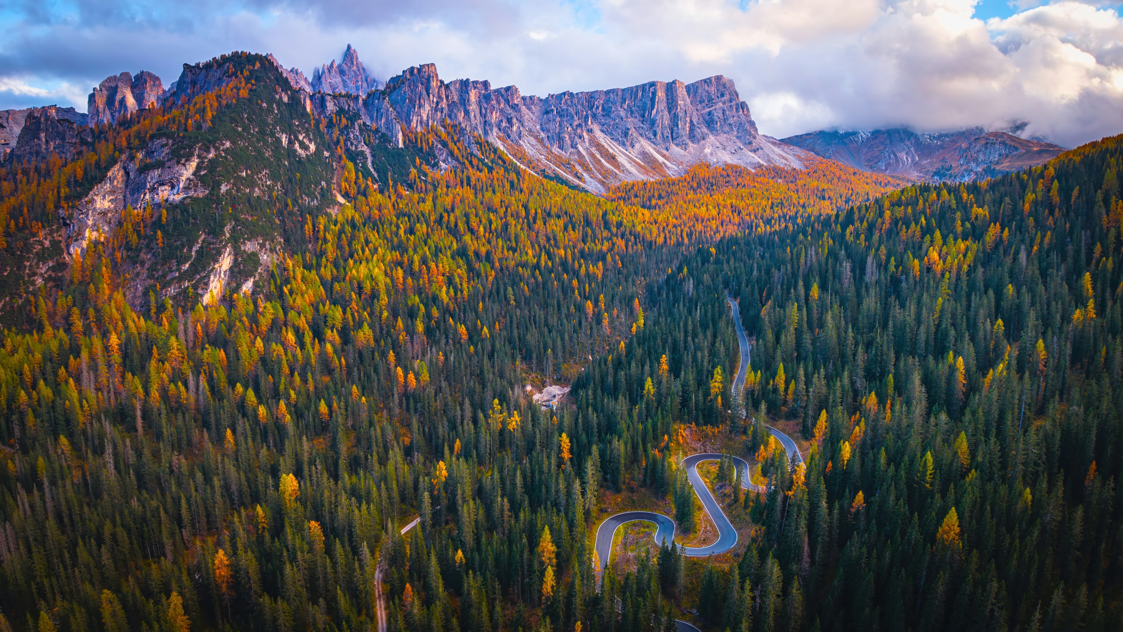 Mountain Road Winding Through Autumn Forest HD Wallpaper