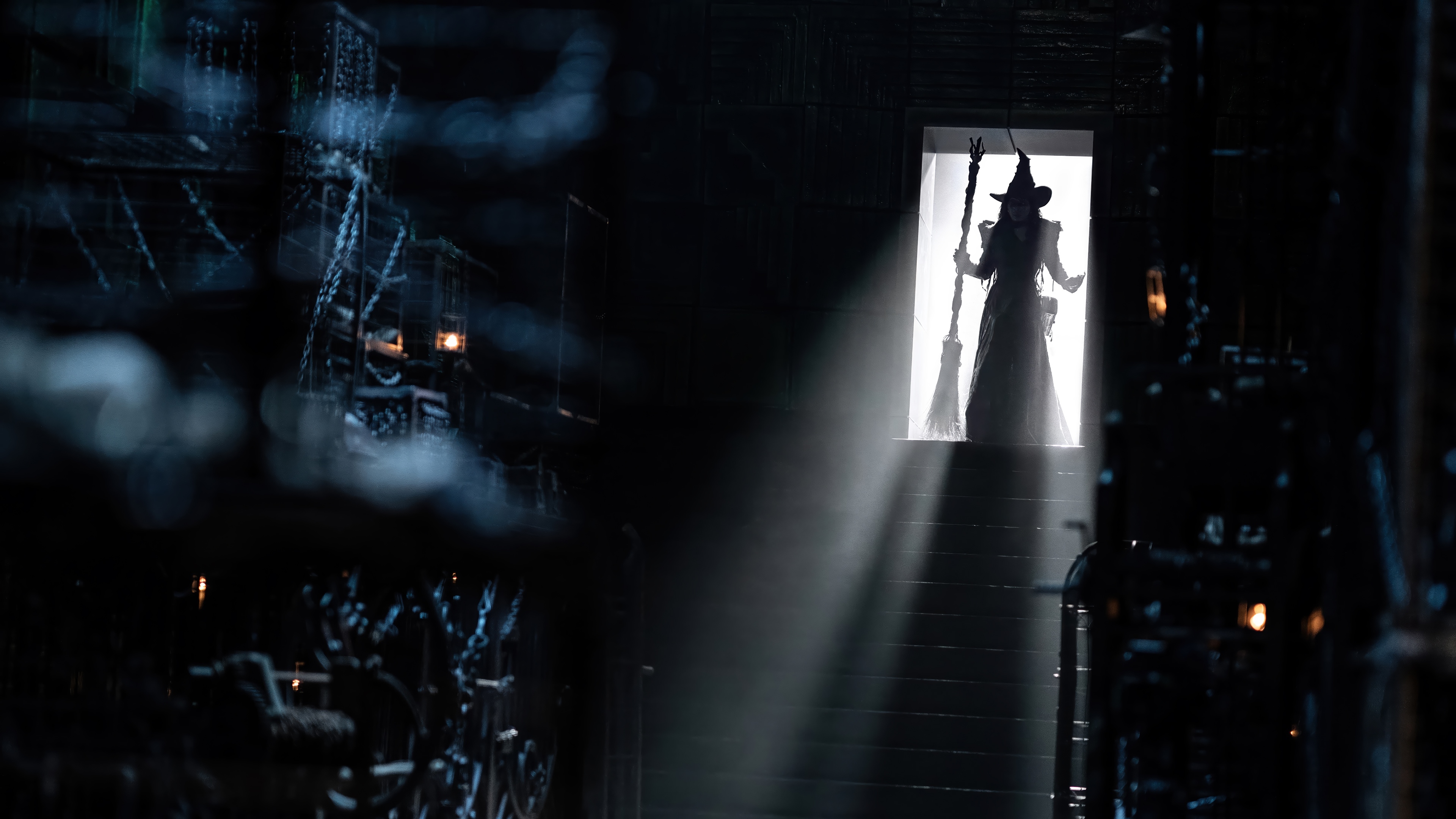 Elphaba with a broom in a doorway HD Wallpaper