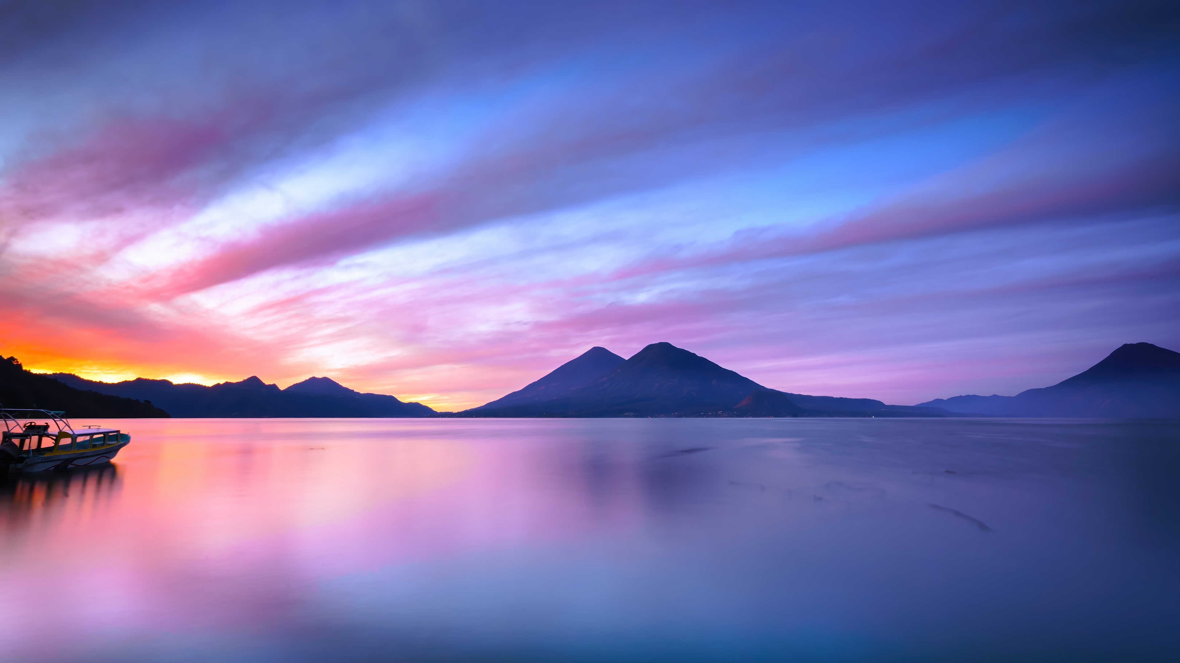Lake Atitlan Sunrise with Volcanoes and Boat HD Wallpaper