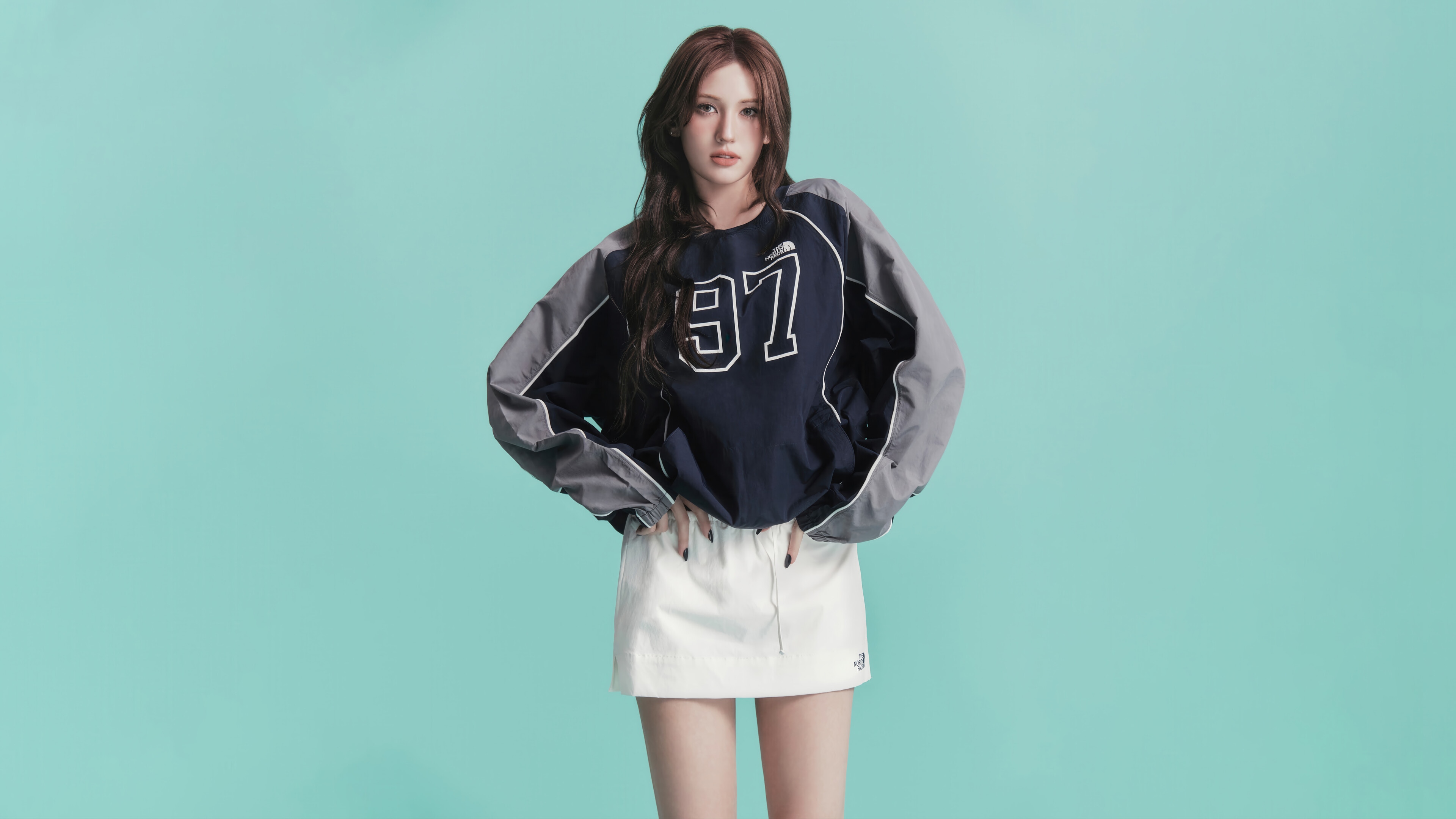 Jeon Somi wearing a navy and gray sweatshirt and white skirt HD Wallpaper