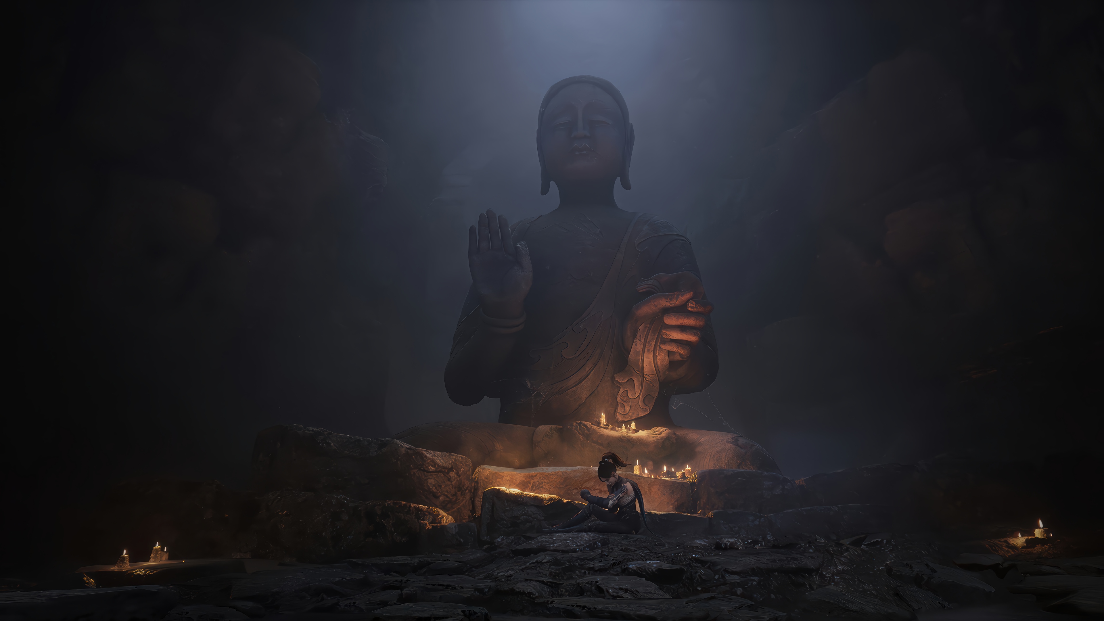 Buddha statue in a dark cave with candles HD Wallpaper