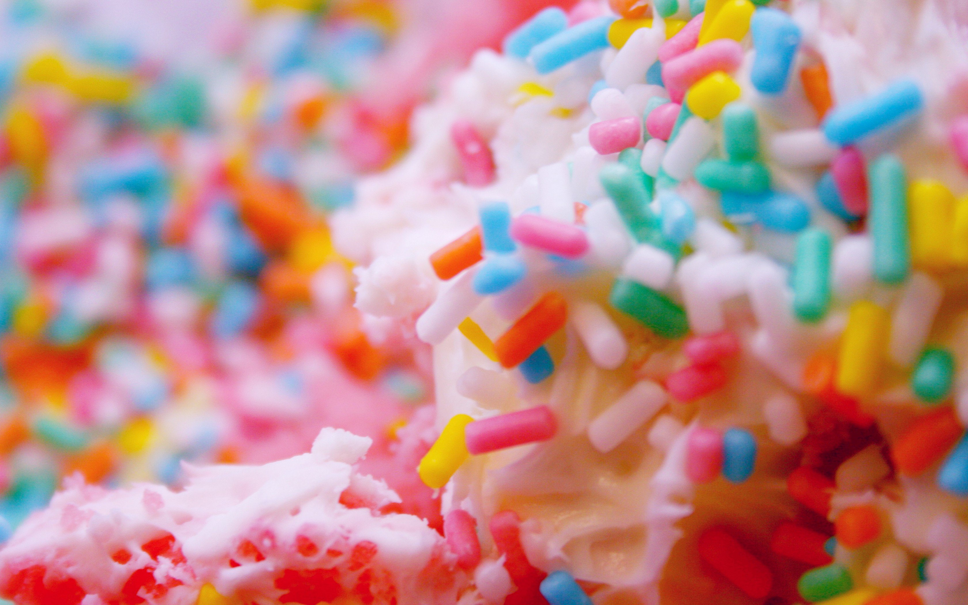 Close-up of colorful sprinkles on frosting HD Wallpaper