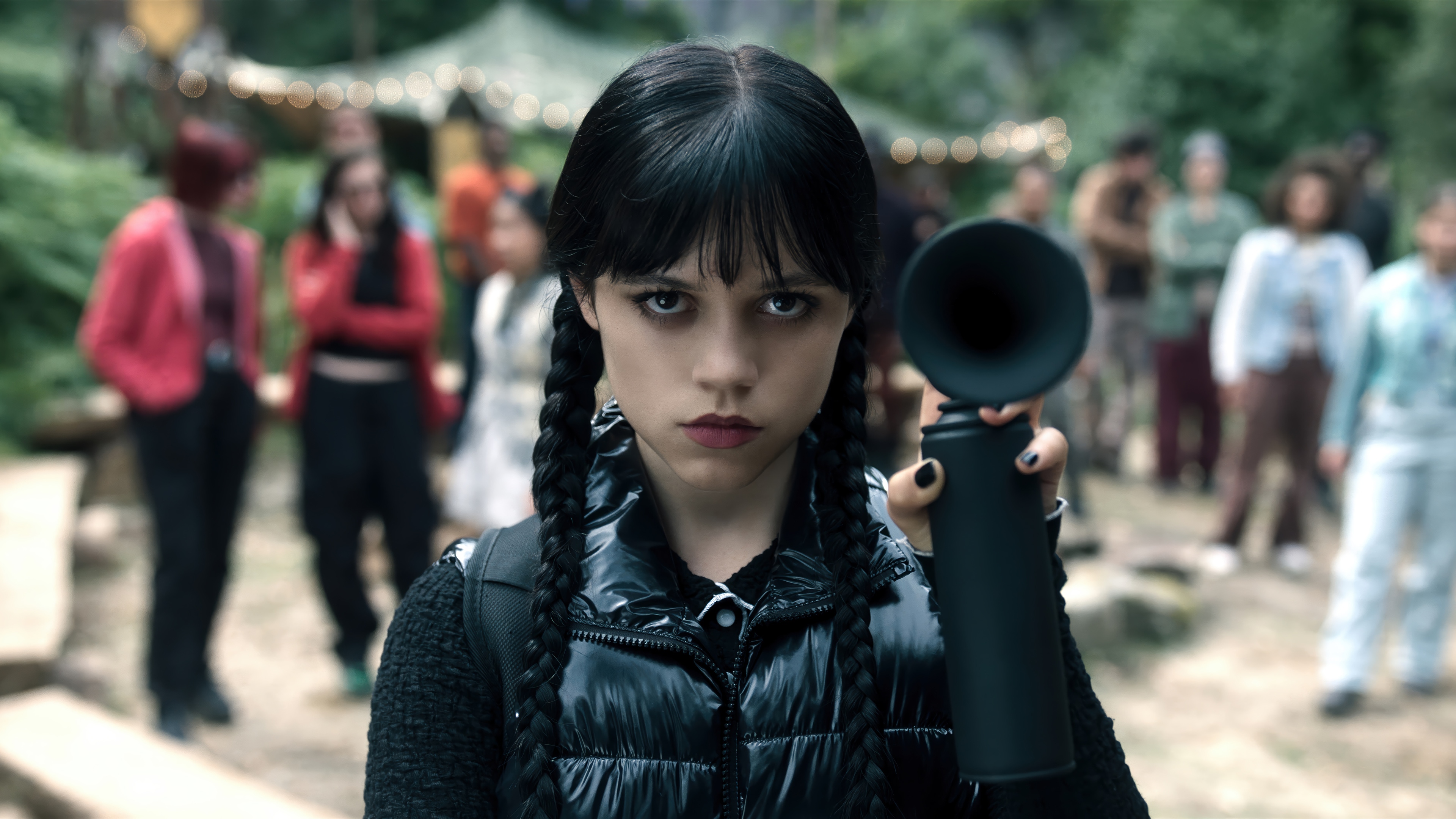 Wednesday Addams holding a black object HD Wallpaper