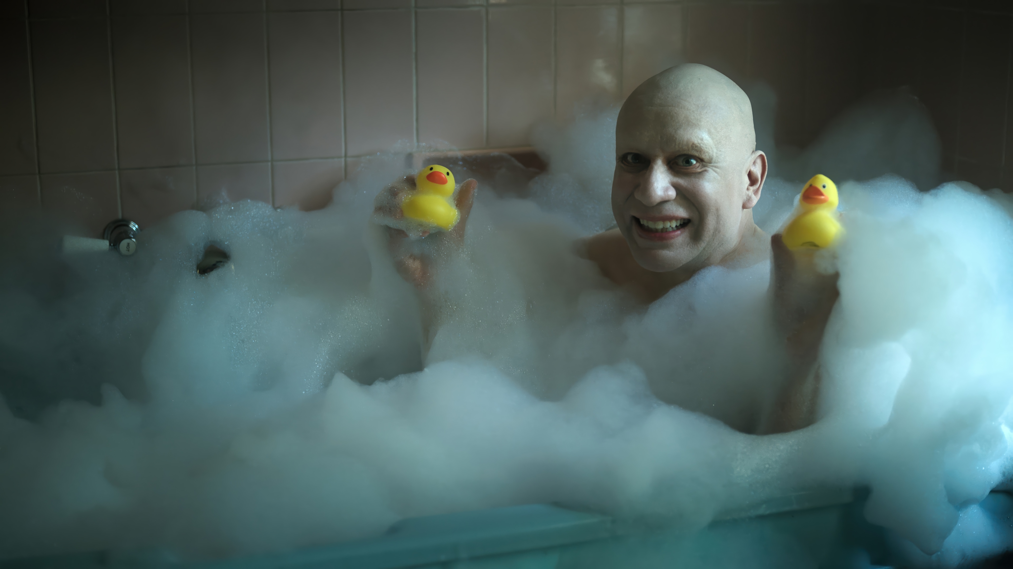 Uncle Fester in a bubble bath with rubber ducks 4K HD Wallpaper