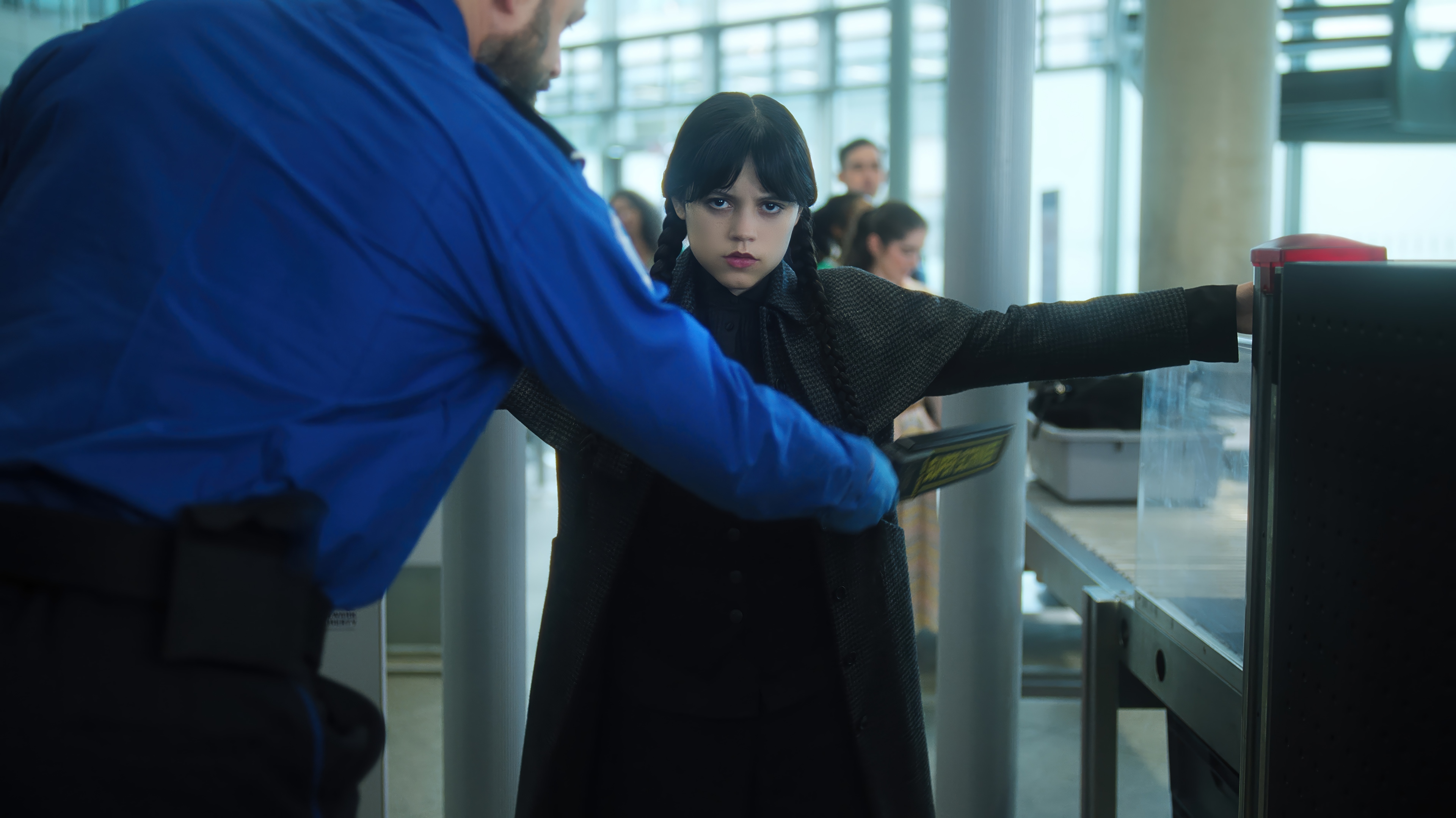 Wednesday Addams at airport security 4K HD Wallpaper