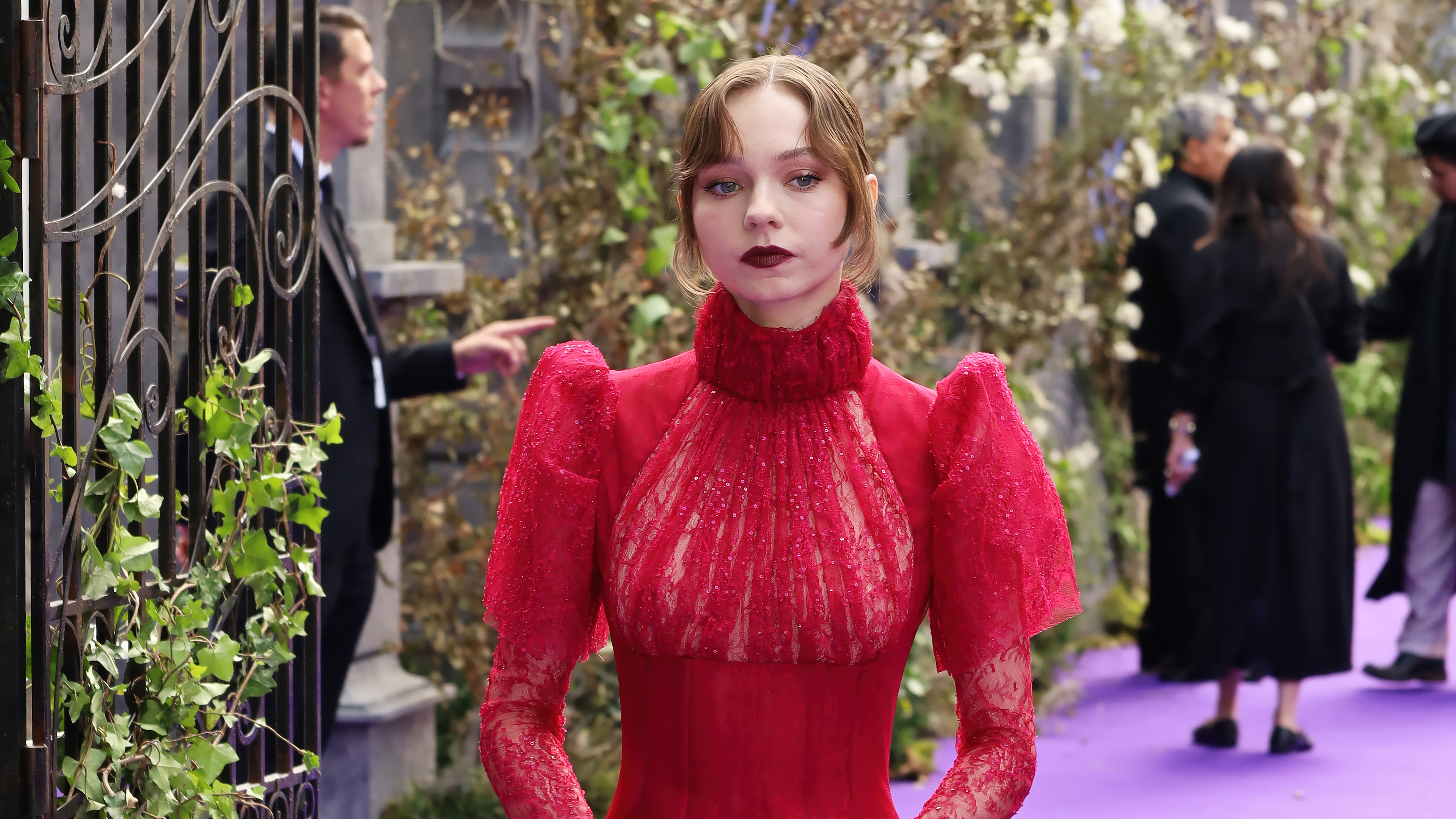 Emma Myers in a red dress at an event HD Wallpaper