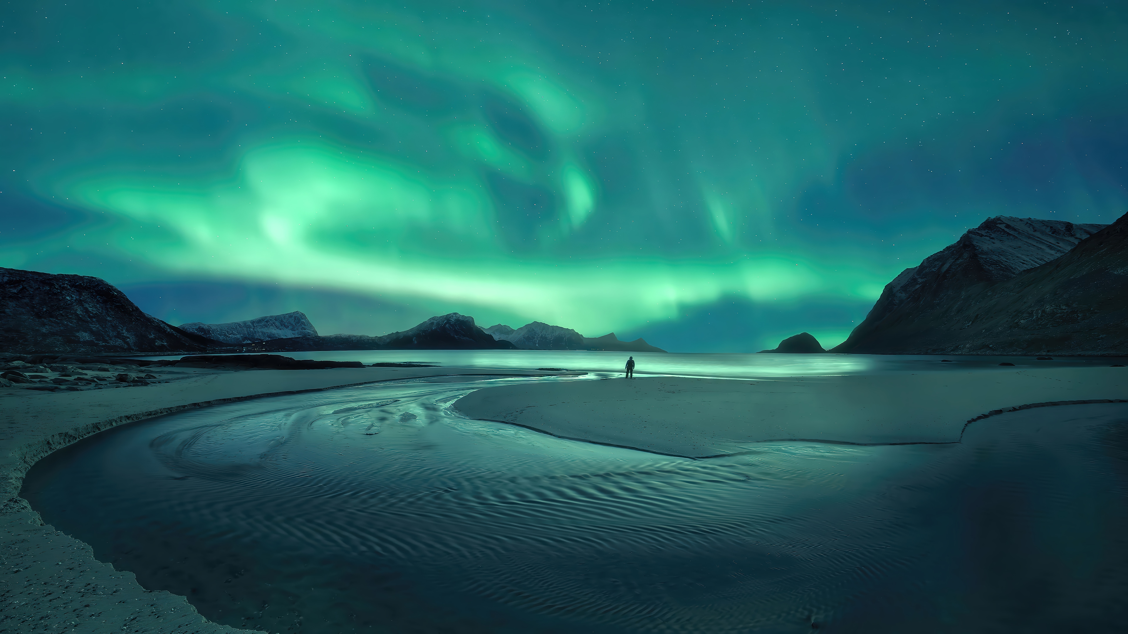 Aurora Borealis over a solitary figure on a beach HD Wallpaper