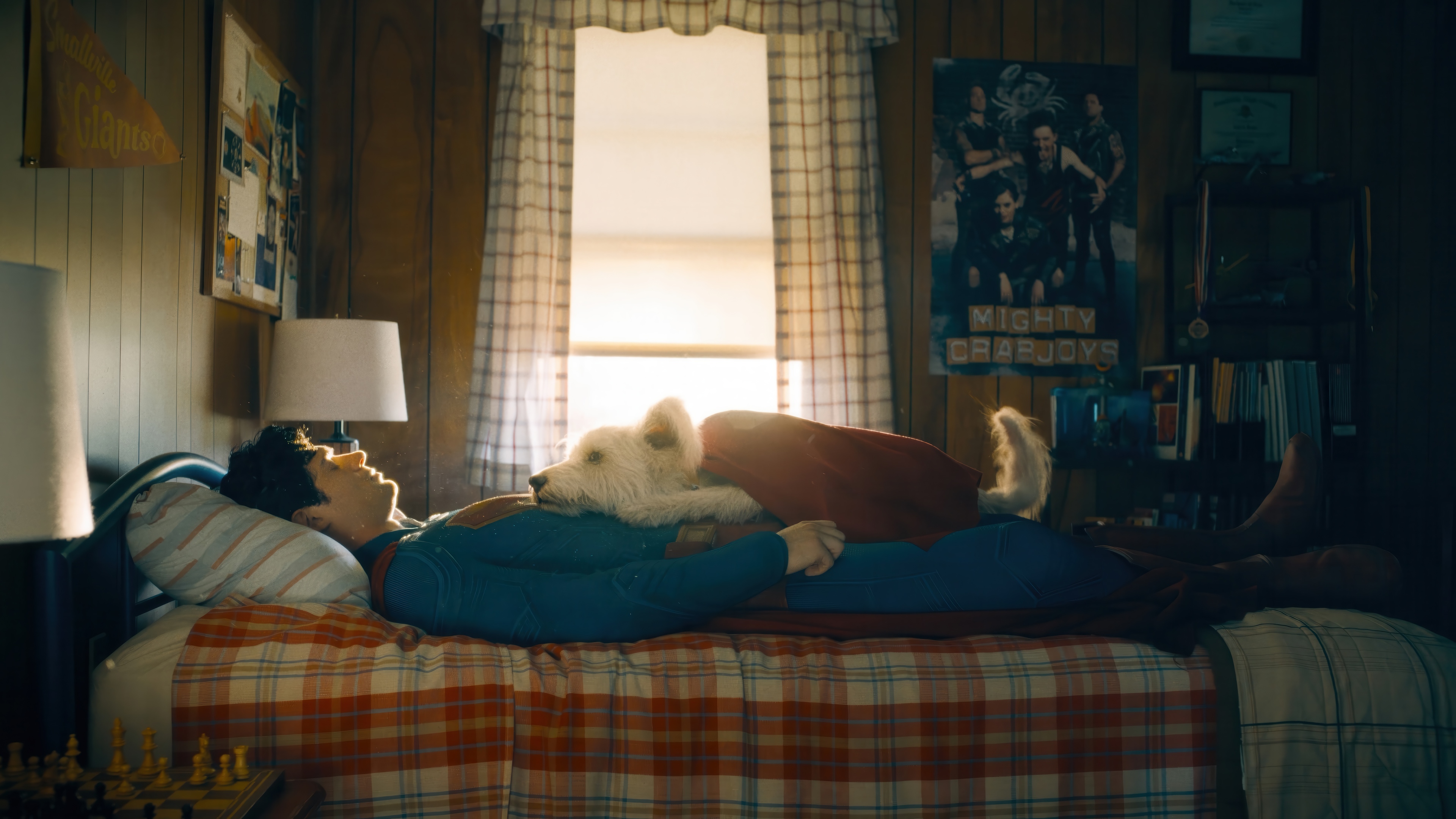 Superman and Krypto resting in a bedroom HD Wallpaper
