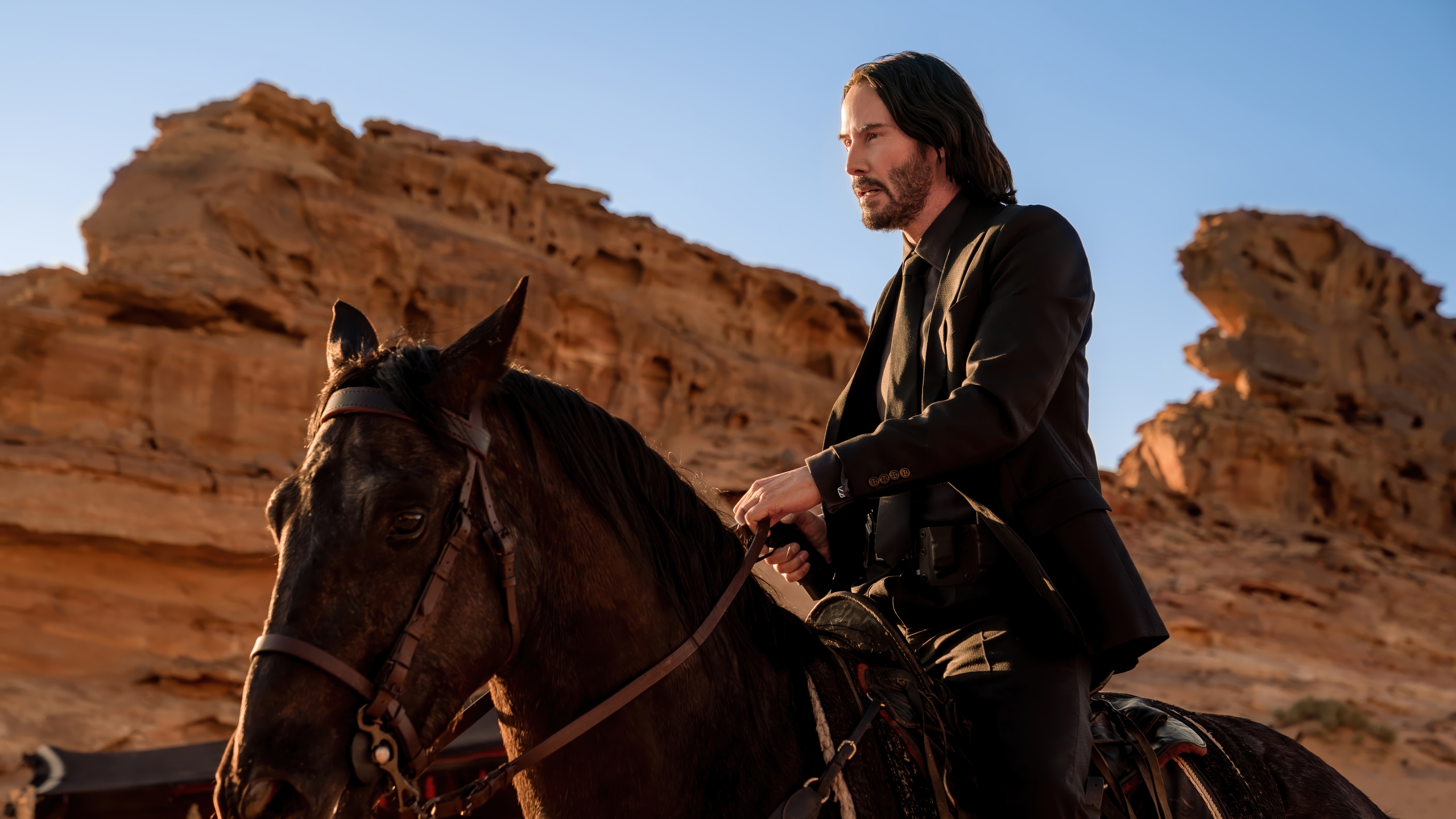 Keanu Reeves as John Wick on Horseback in Desert HD Wallpaper