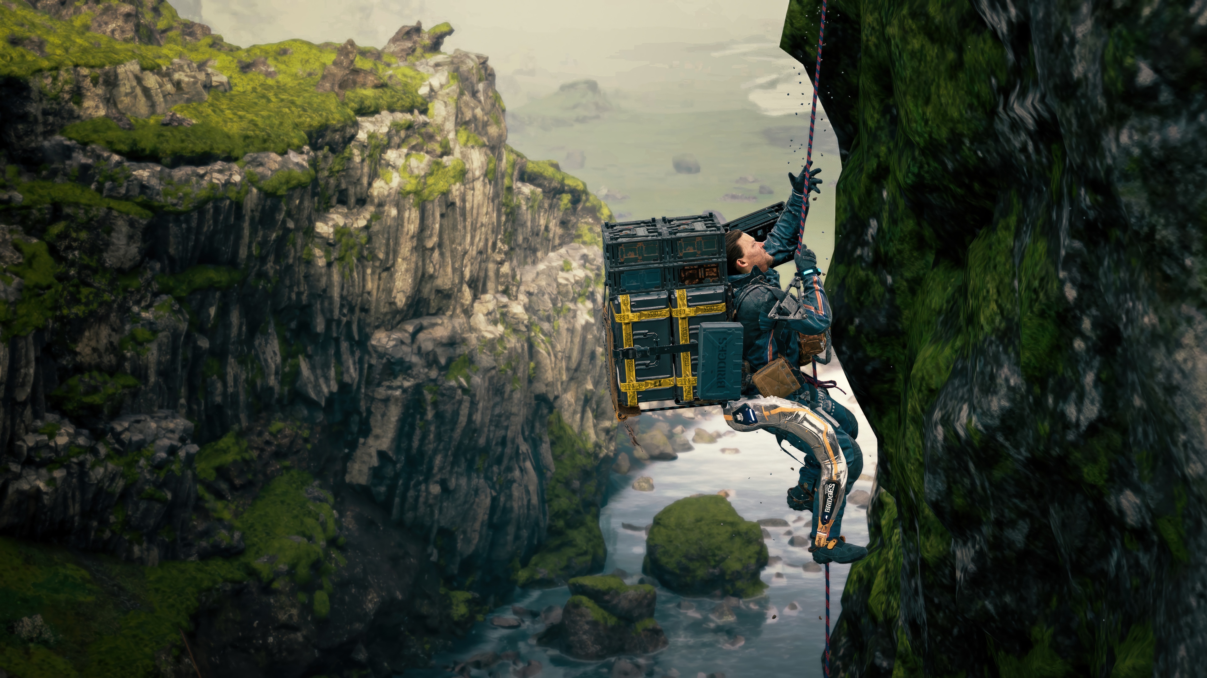 Death Stranding 2 character rappelling down a cliff HD Wallpaper