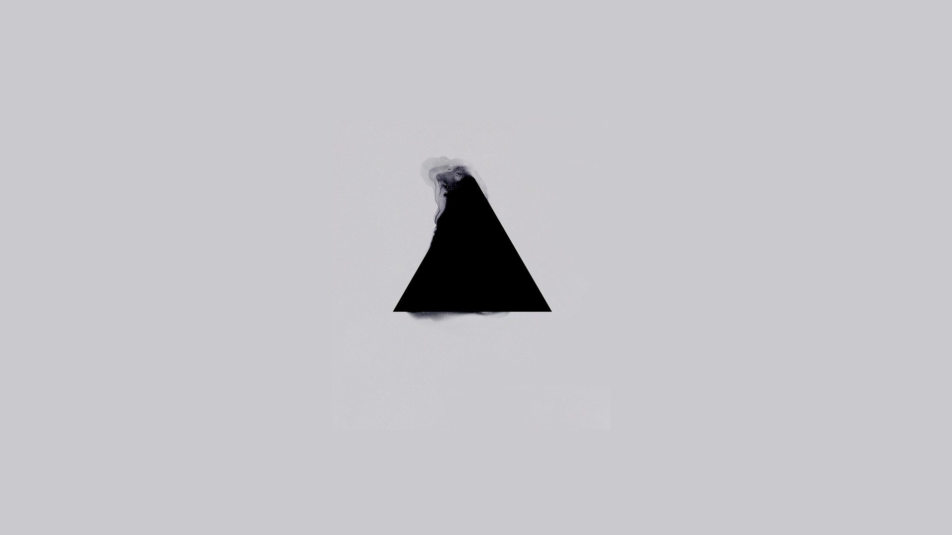 Black triangle with smoke on gray background HD Wallpaper