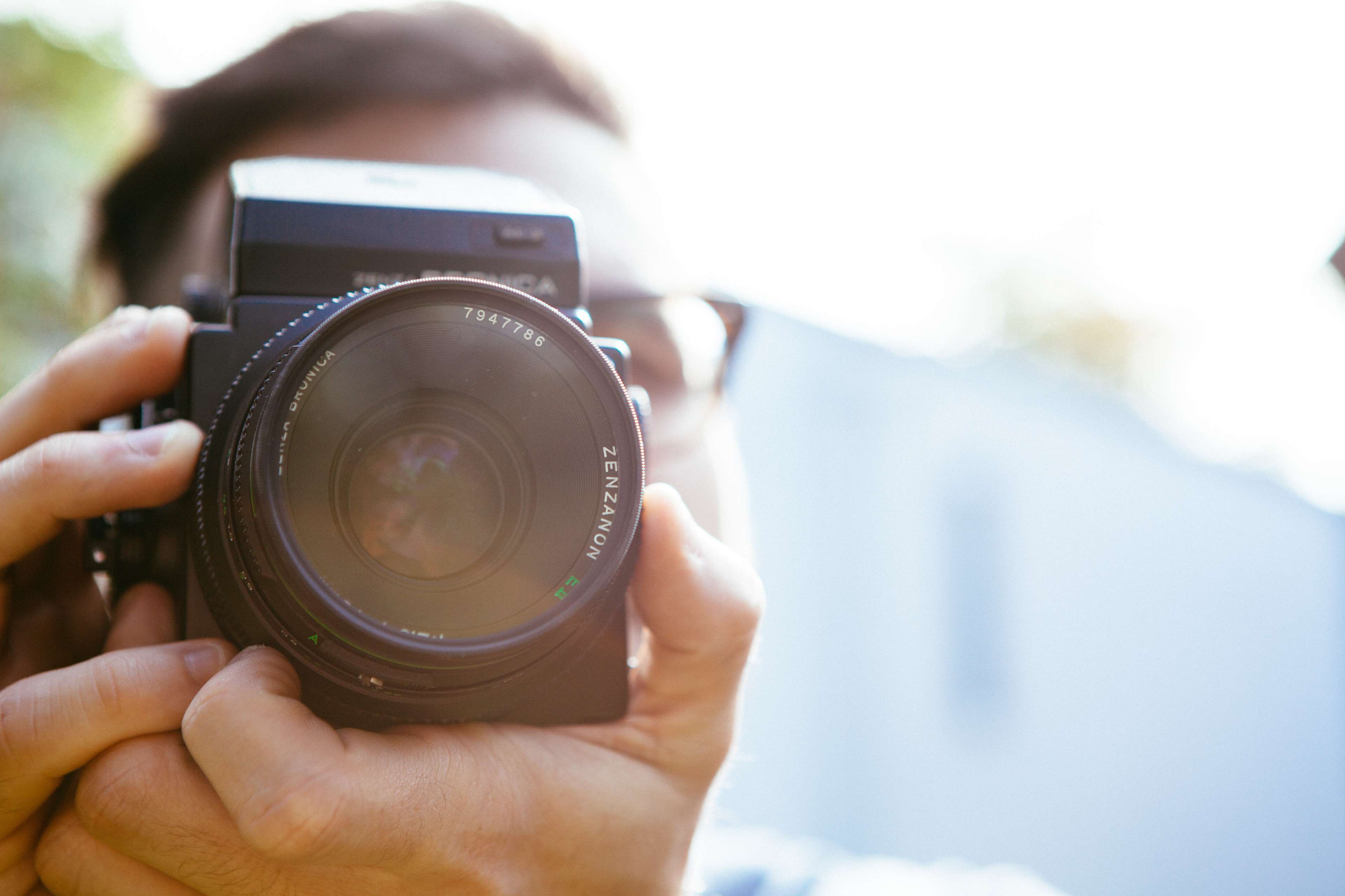 Person holding a Bronica medium format camera HD Wallpaper