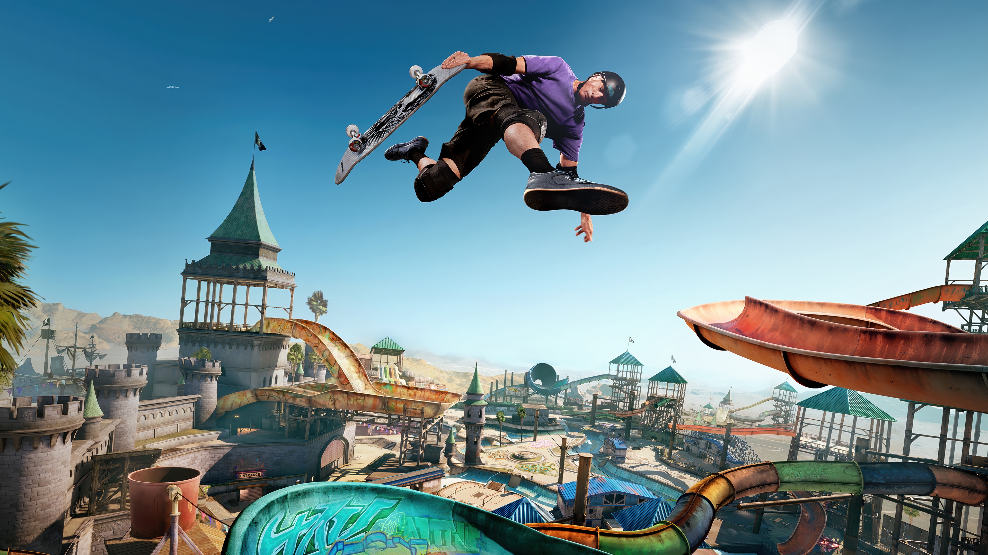 Skateboarder performing a trick in a water park HD Wallpaper
