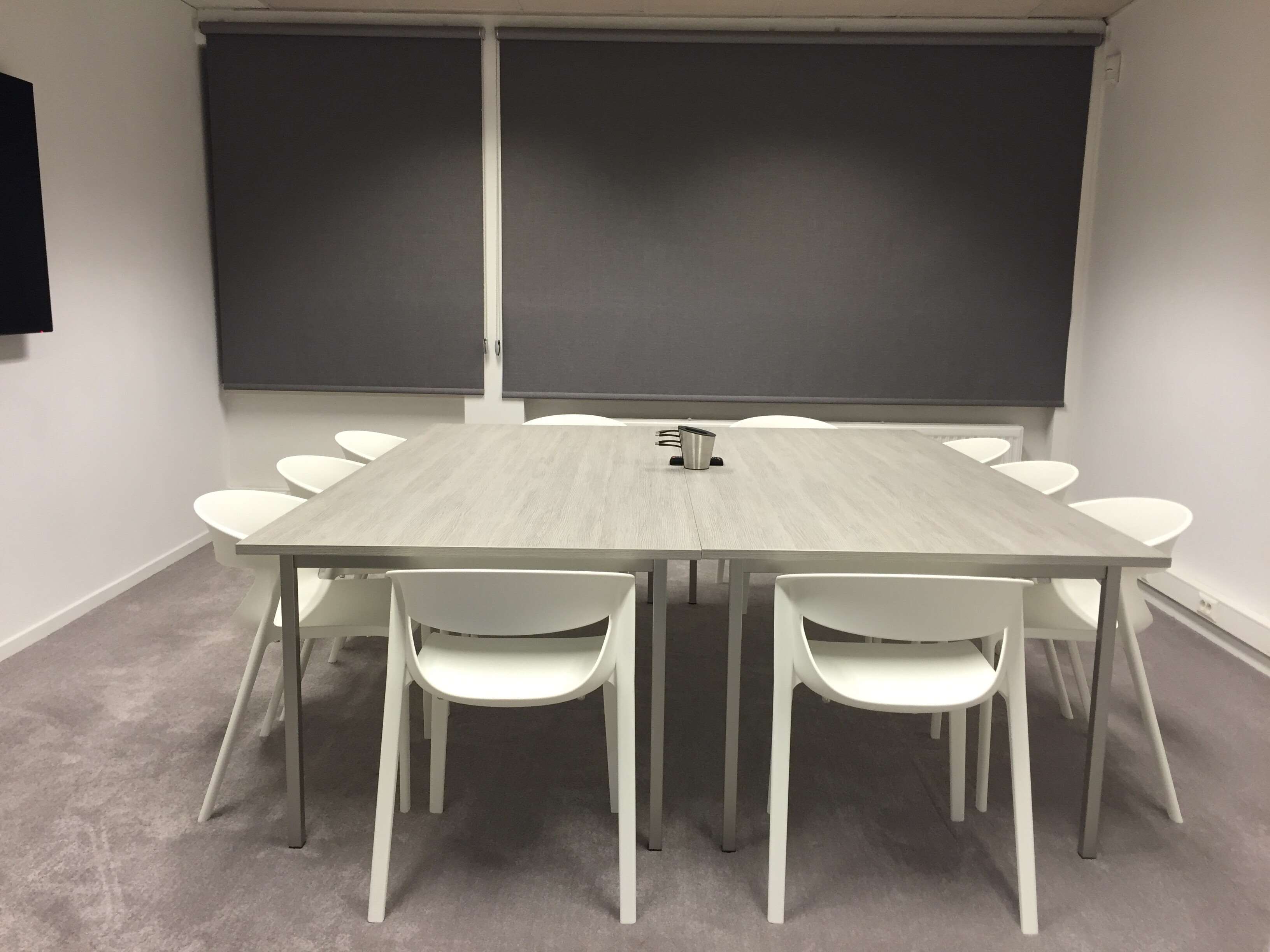 Modern meeting room with square table and white chairs HD Wallpaper