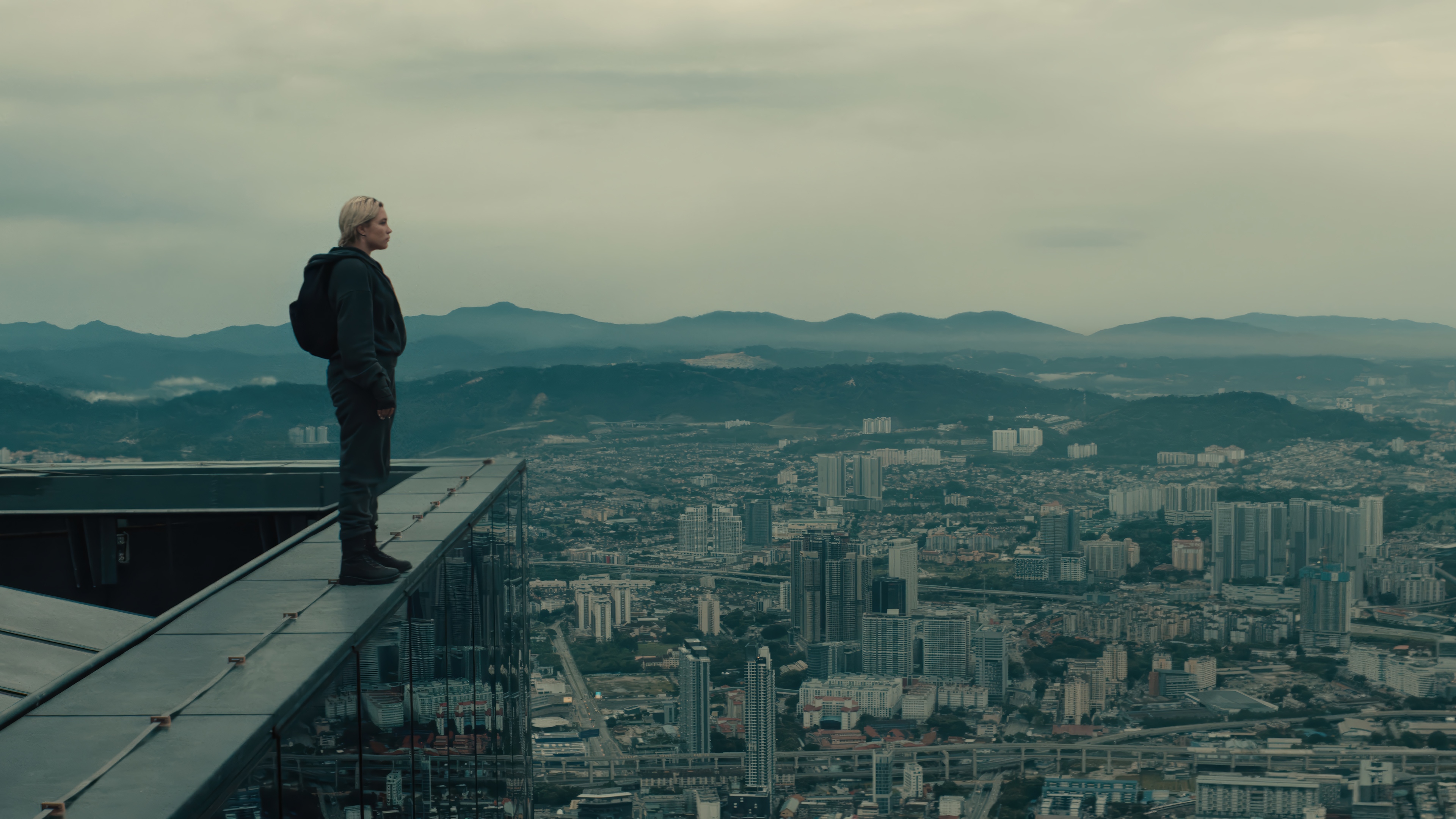 Yelena Belova on a skyscraper edge 4K HD Wallpaper