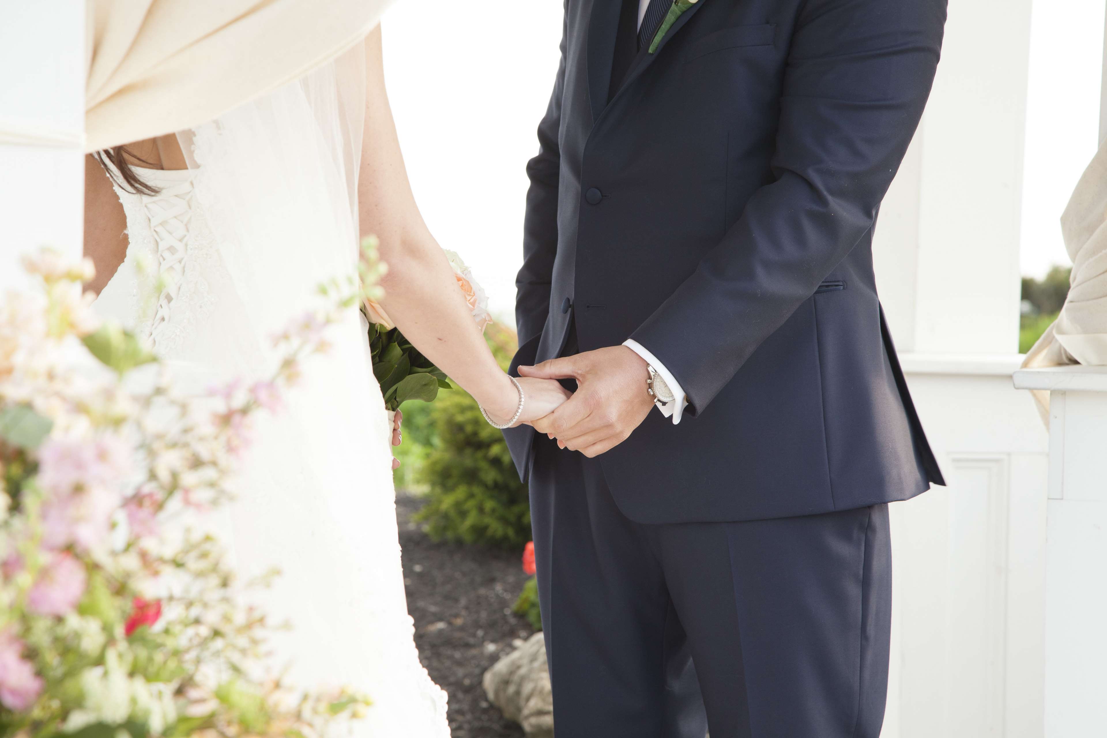 Bride and groom holding hands on wedding day 4K HD Wallpaper