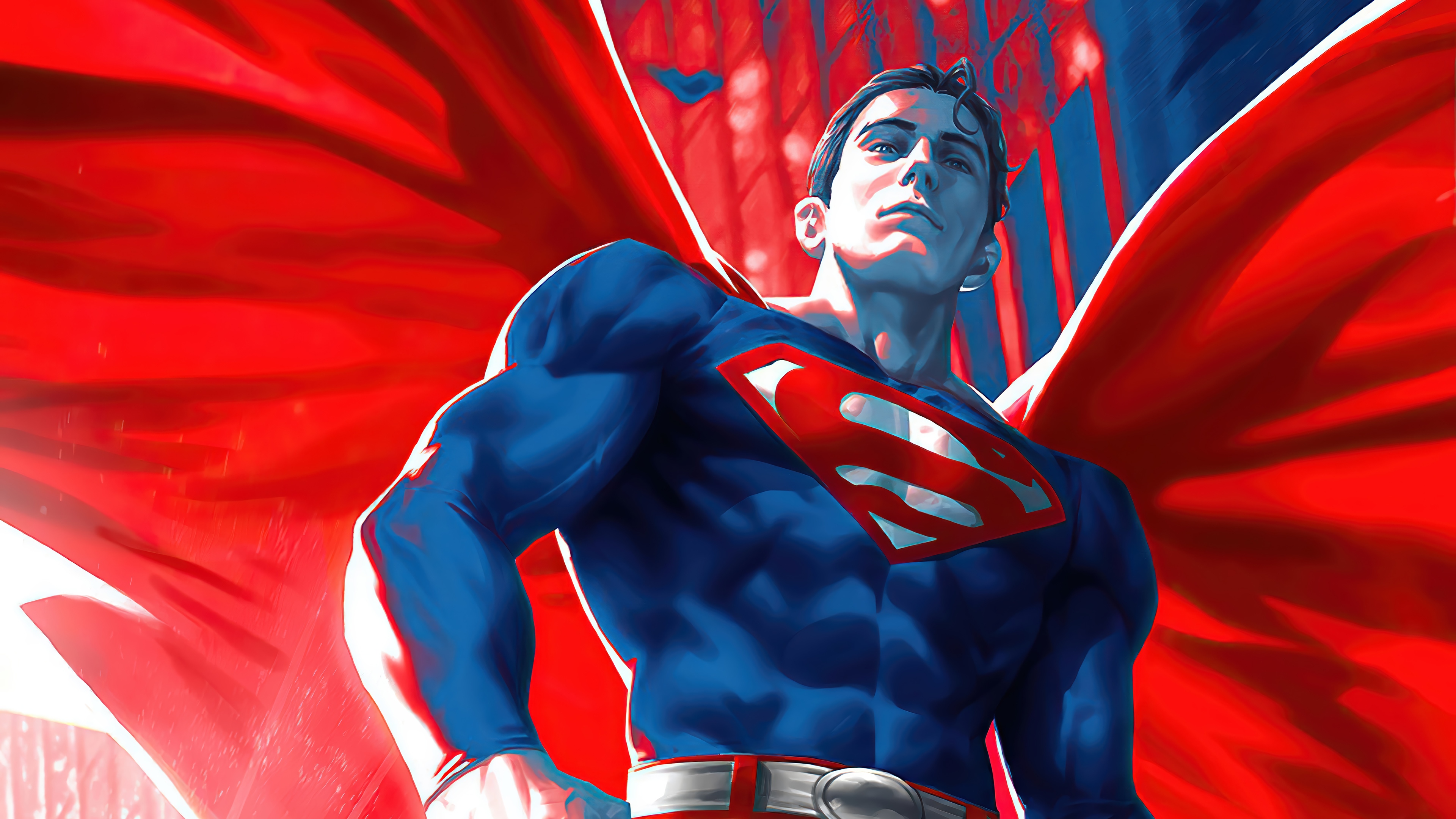 Superman in a red cape and blue suit 4K HD Wallpaper