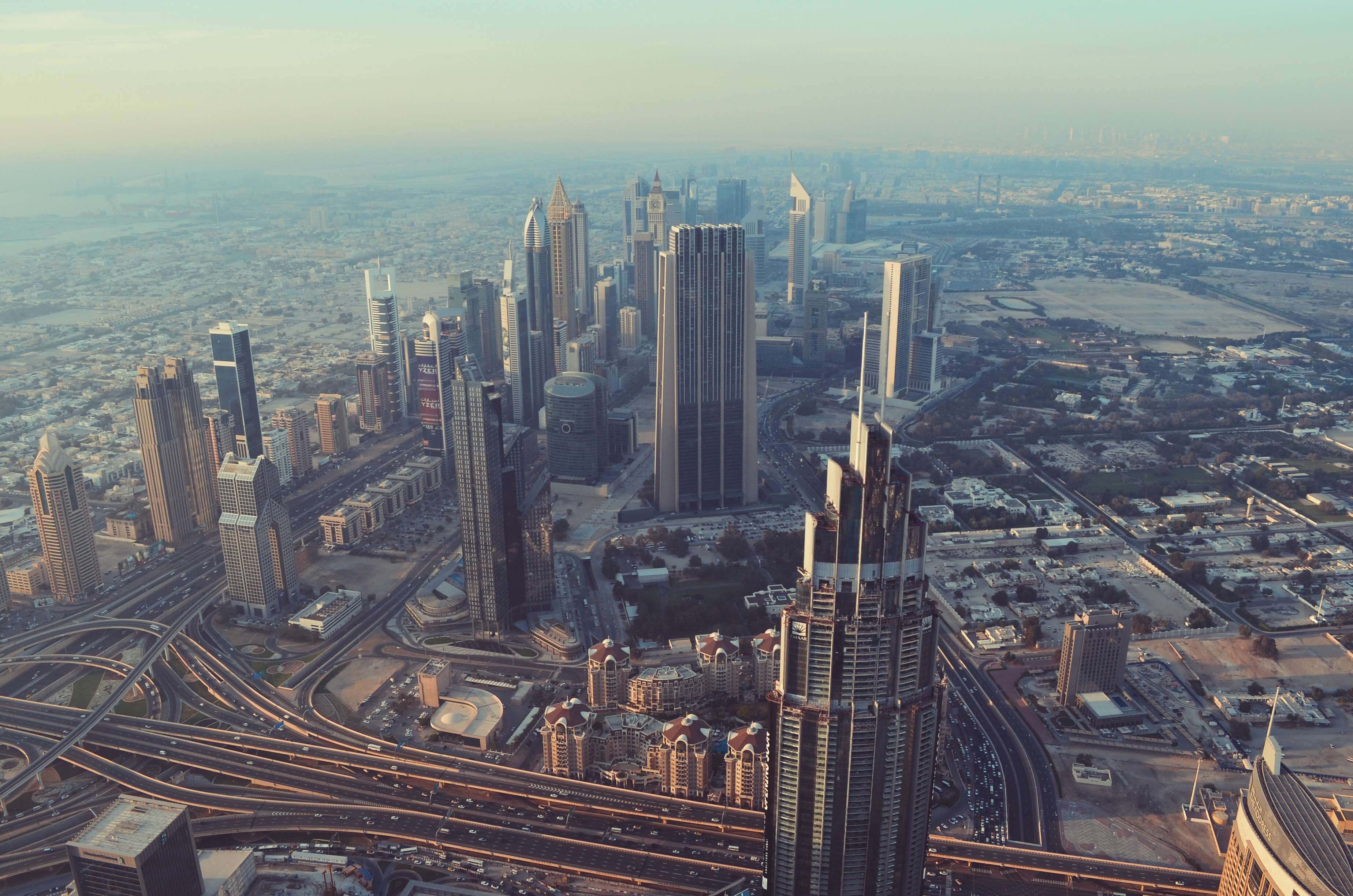 Aerial view of Dubai skyscrapers and highways HD Wallpaper