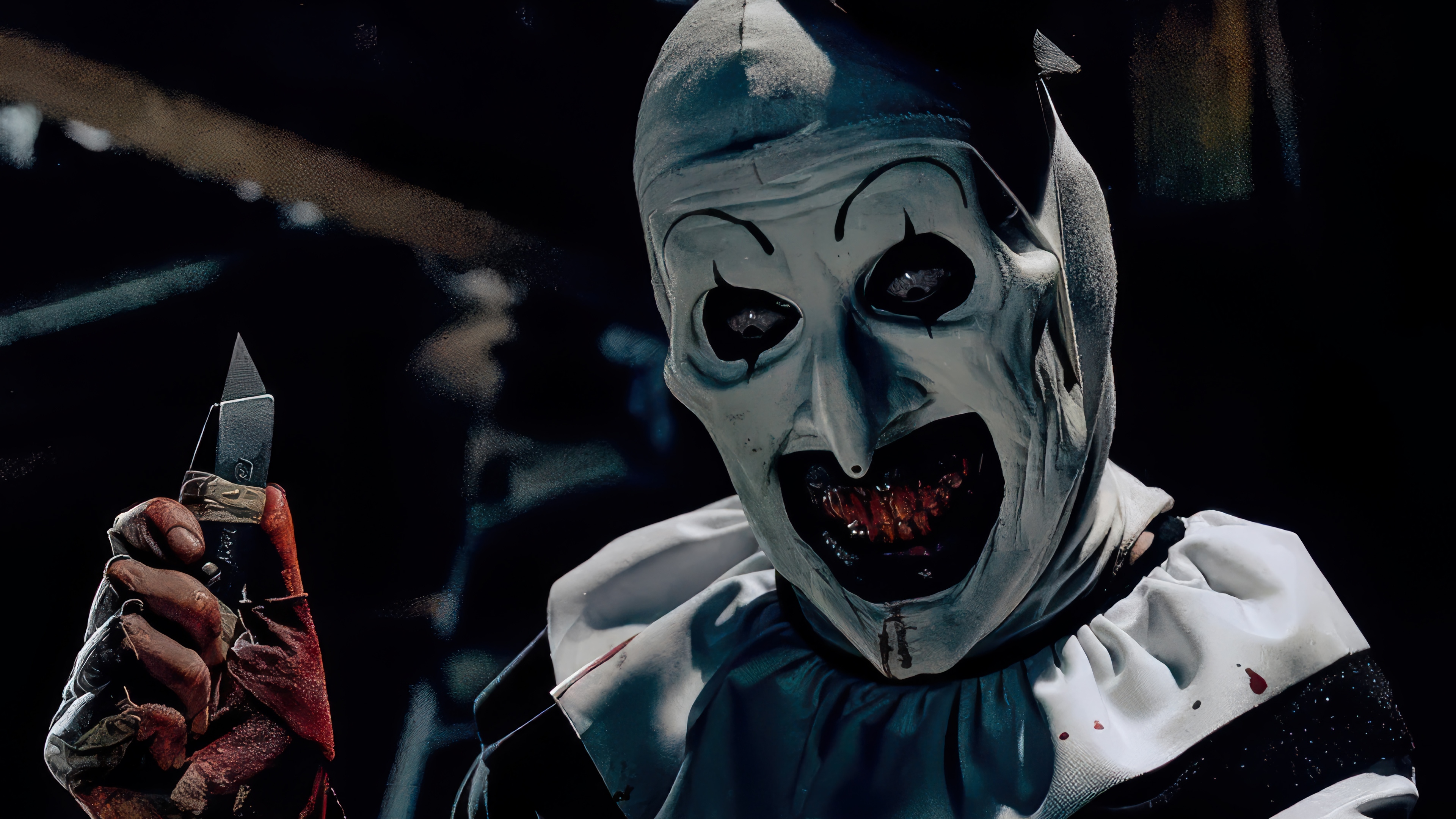 Art the Clown from Terrifier holding a knife HD Wallpaper